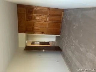 Unfurnished secondary bedroom/office featuring new carpeting and a built-in closet. Unfurnished secondary bedroom/office featuring new carpeting and a built-in closet.