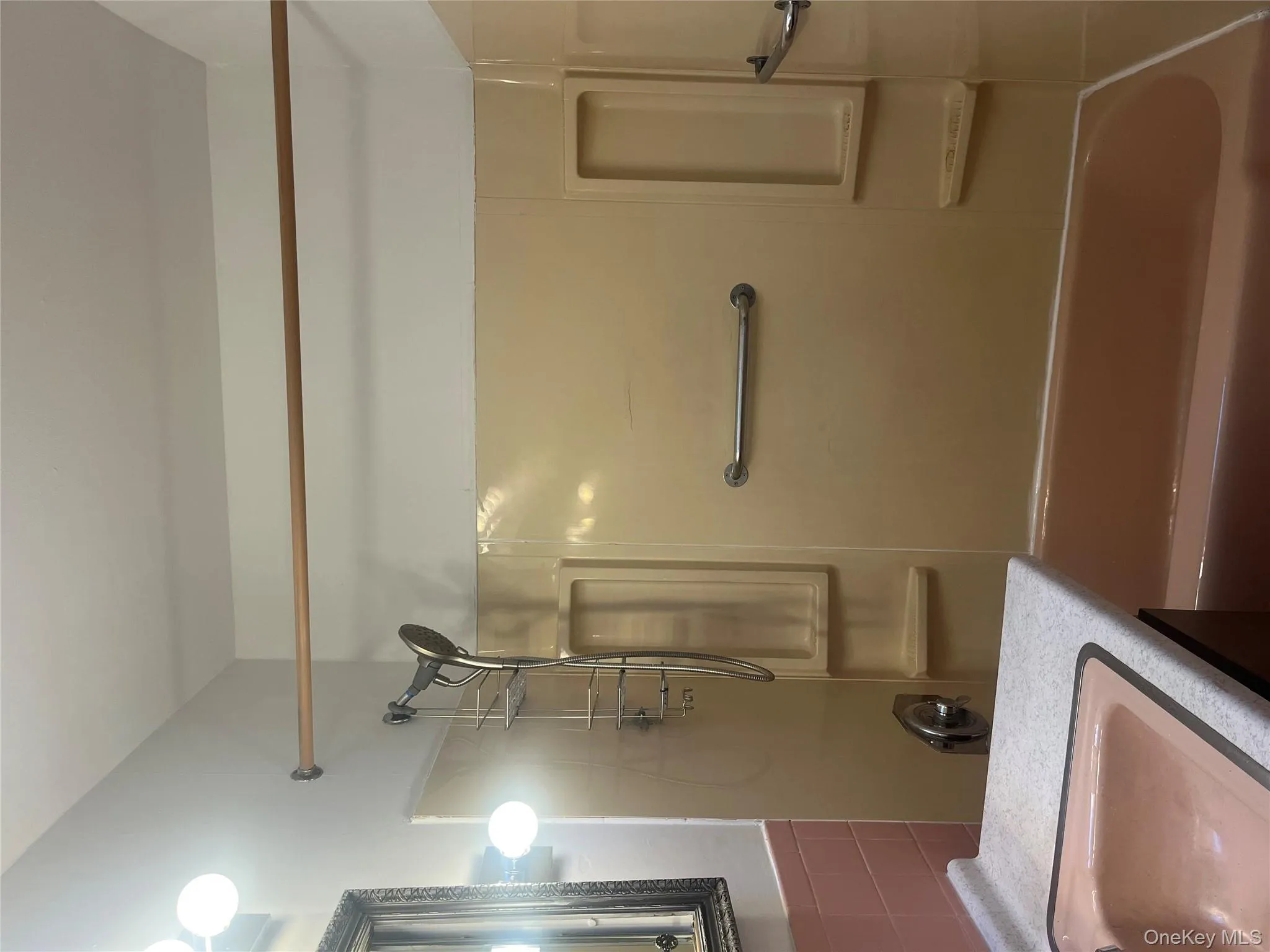 Bathroom featuring vanity and tub / shower combination Bathroom featuring vanity and tub / shower combination