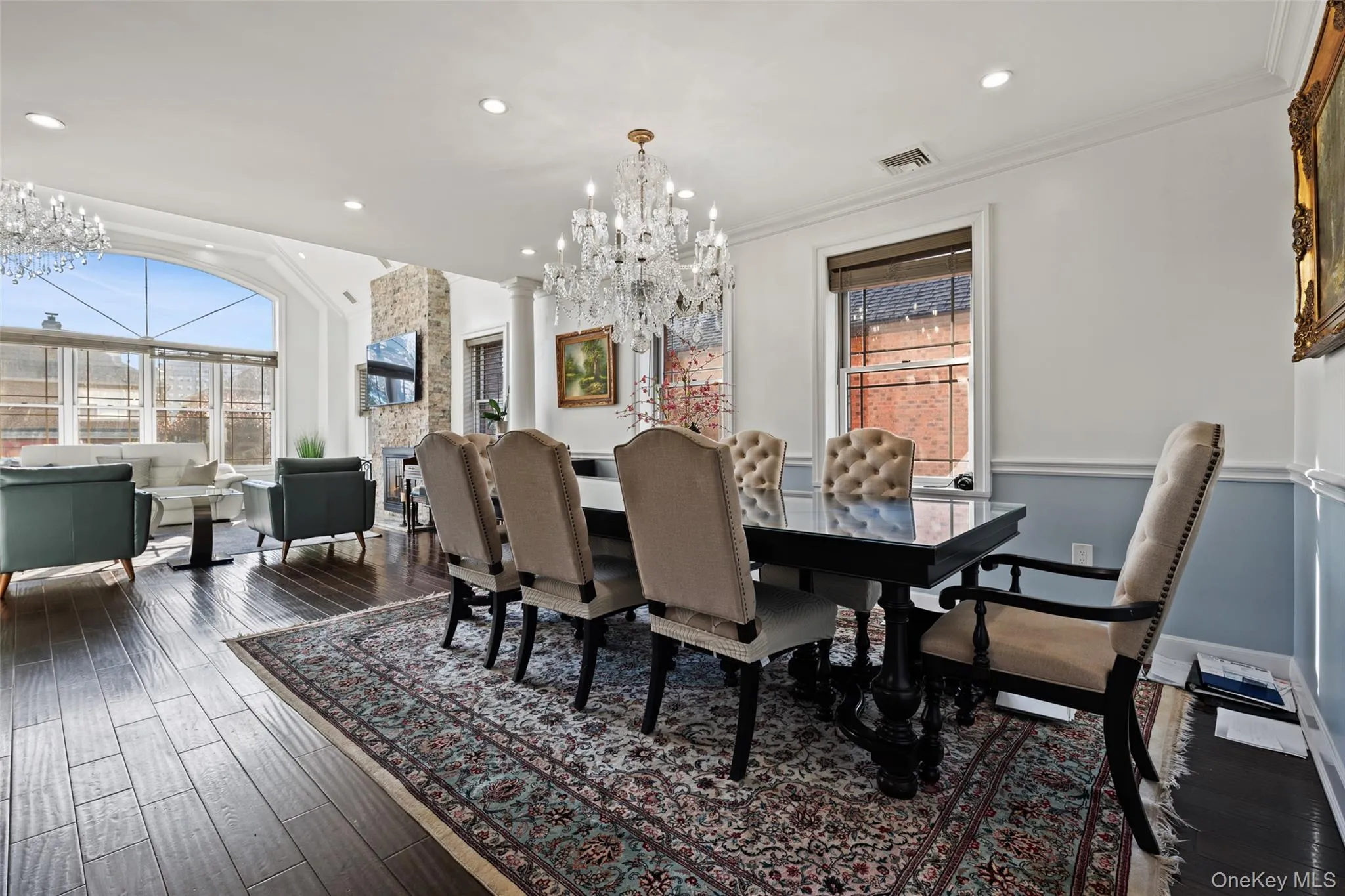 Dining room with a chandelier, dark wood-style flooring, ornamental molding, recessed lighting, and plenty of natural light Dining room with a chandelier, dark wood-style flooring, ornamental molding, recessed lighting, and plenty of natural light