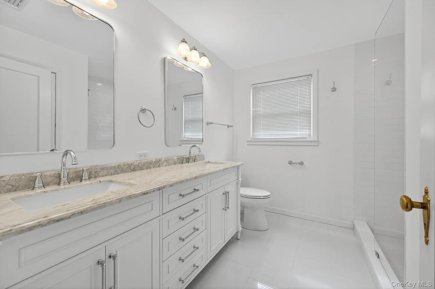 Second floor Full bathroom with tiled shower, double vanity, and light tile patterned flooring Second floor Full bathroom with tiled shower, double vanity, and light tile patterned flooring