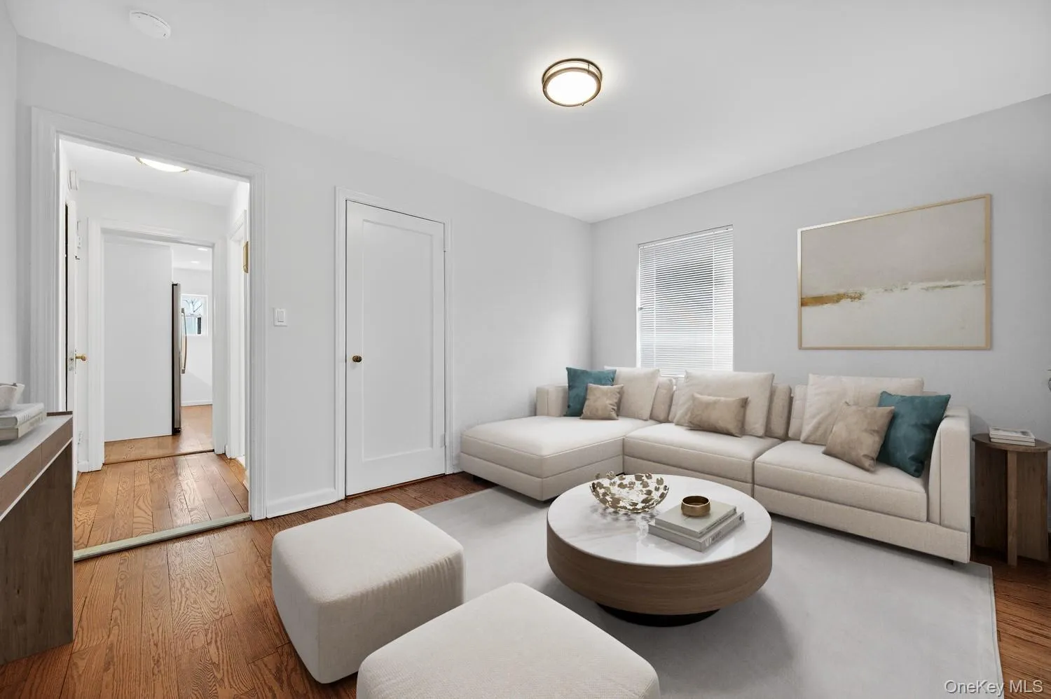 Virtually Staged - Living room with hardwood / wood-style flooring and baseboards Virtually Staged - Living room with hardwood / wood-style flooring and baseboards