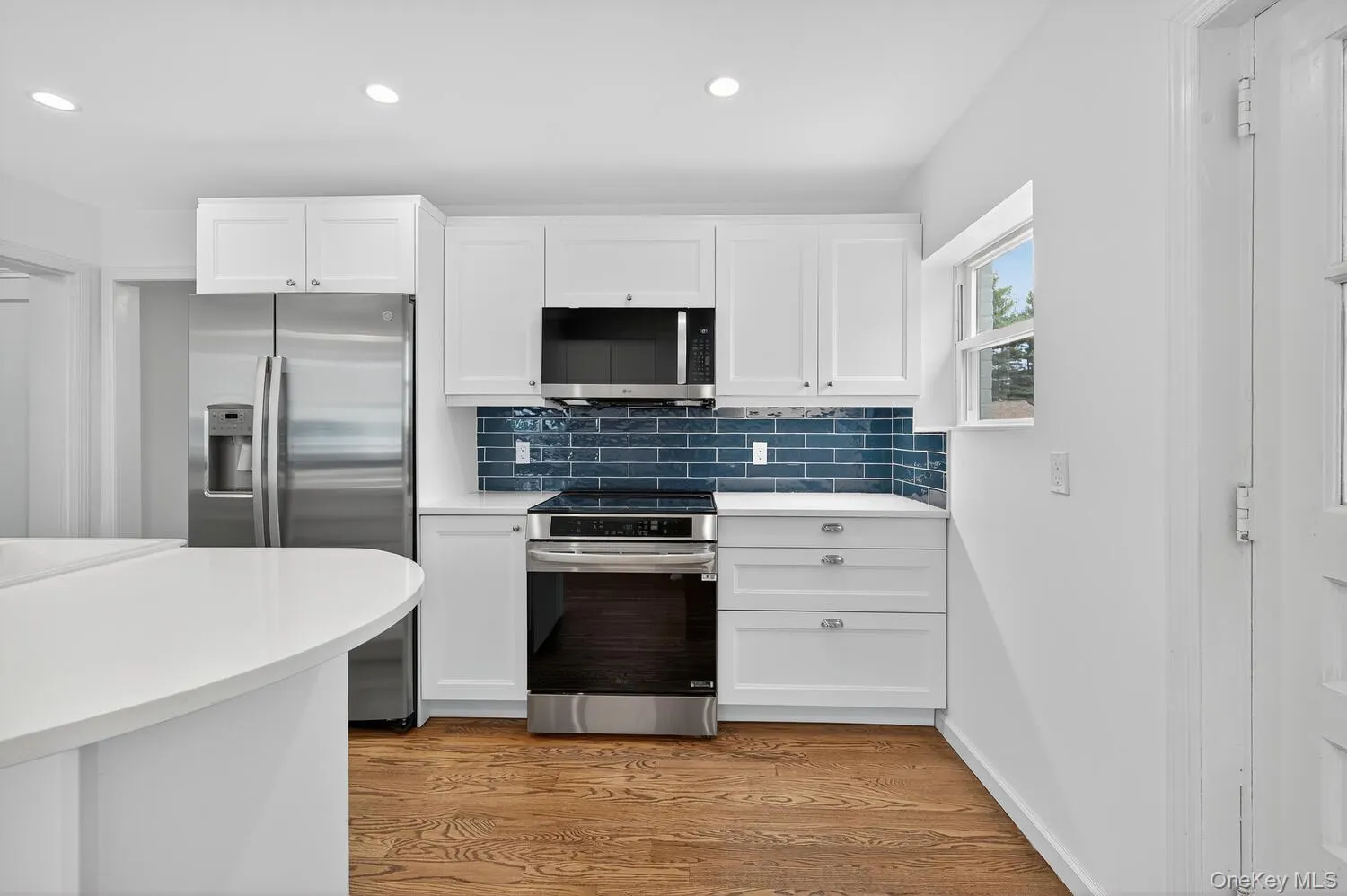 Kitchen featuring a stainless steel induction stove. Kitchen featuring a stainless steel induction stove.