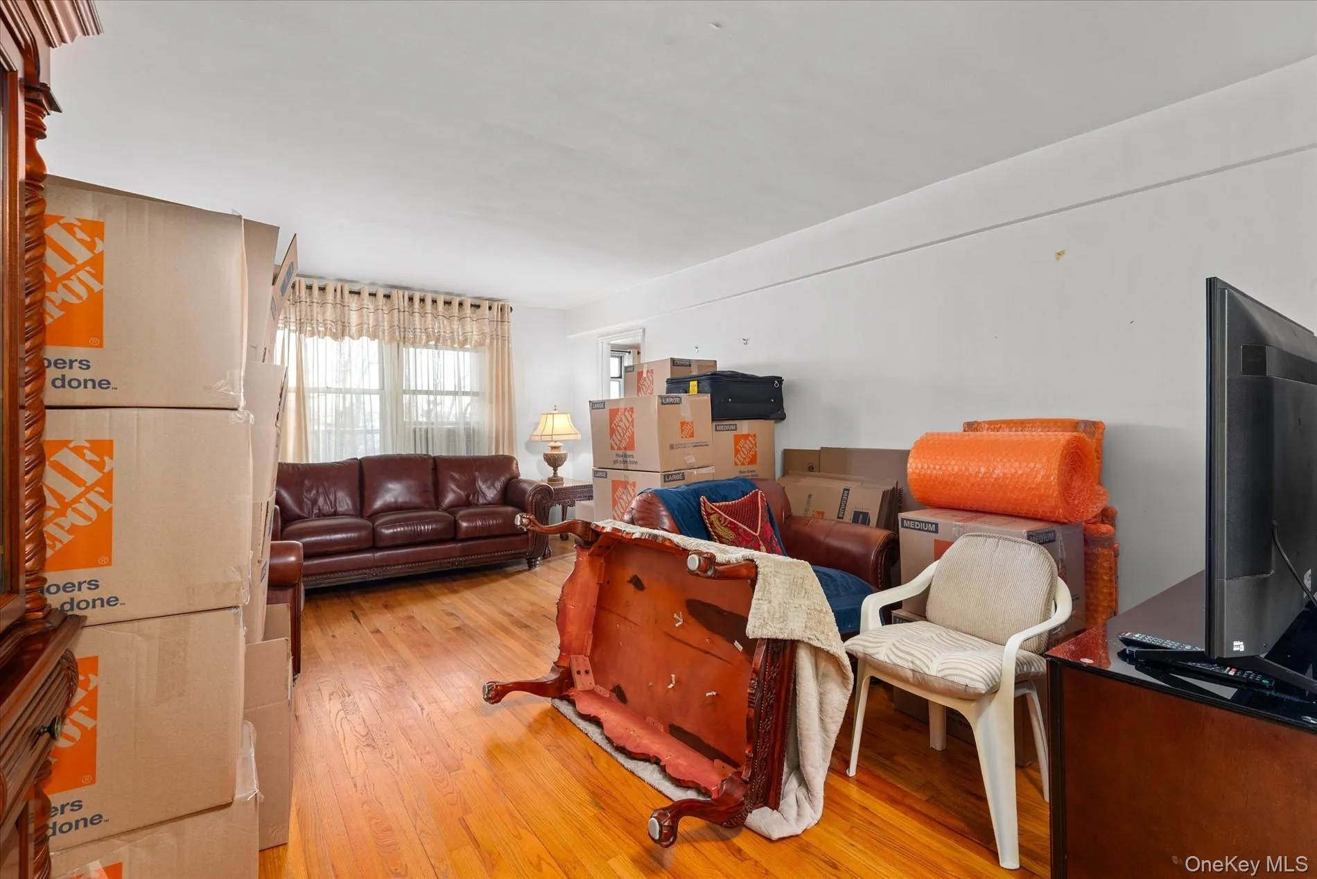 Living room with light wood-style flooring Living room with light wood-style flooring