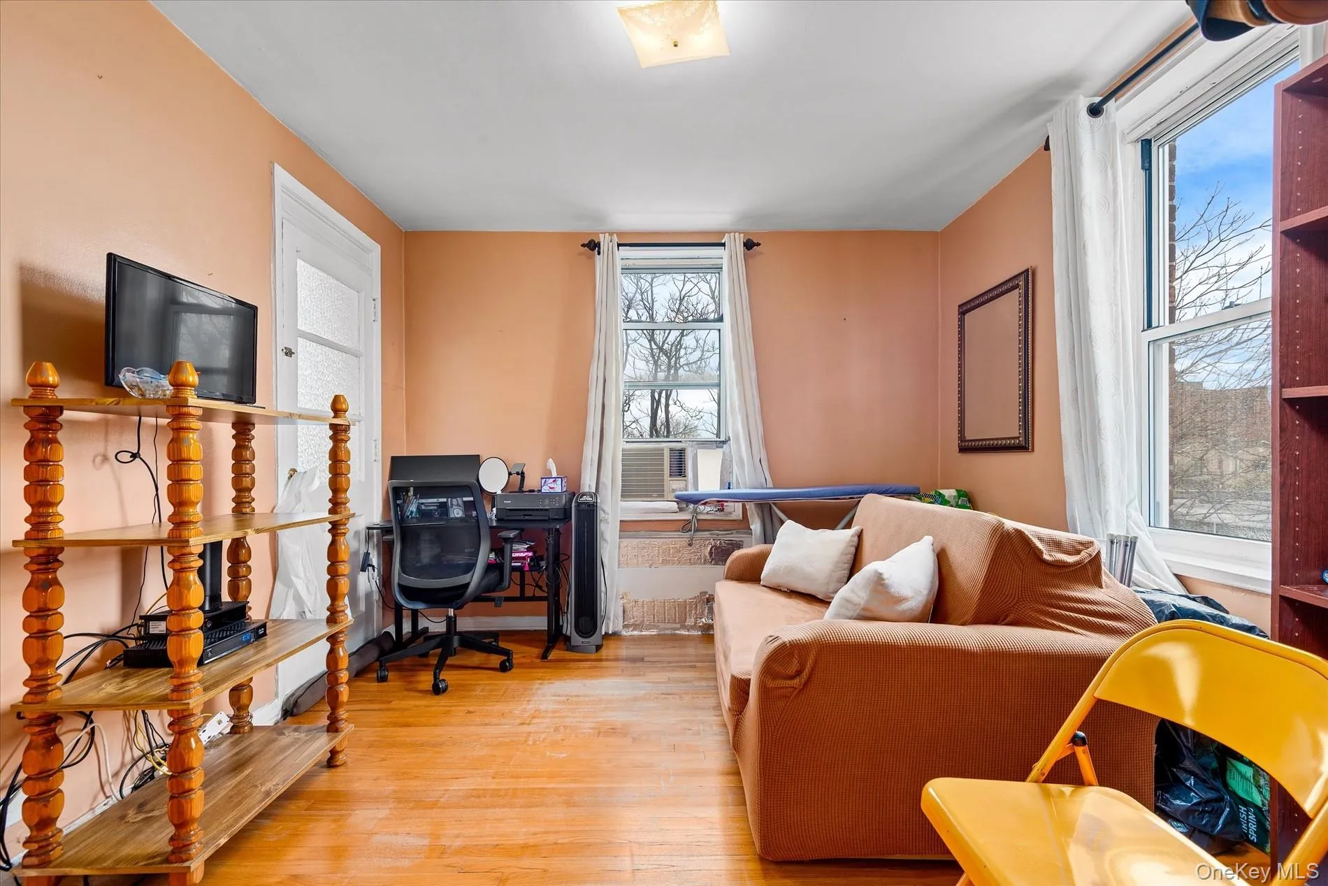 Home office featuring wood finished floors and healthy amount of natural light Home office featuring wood finished floors and healthy amount of natural light
