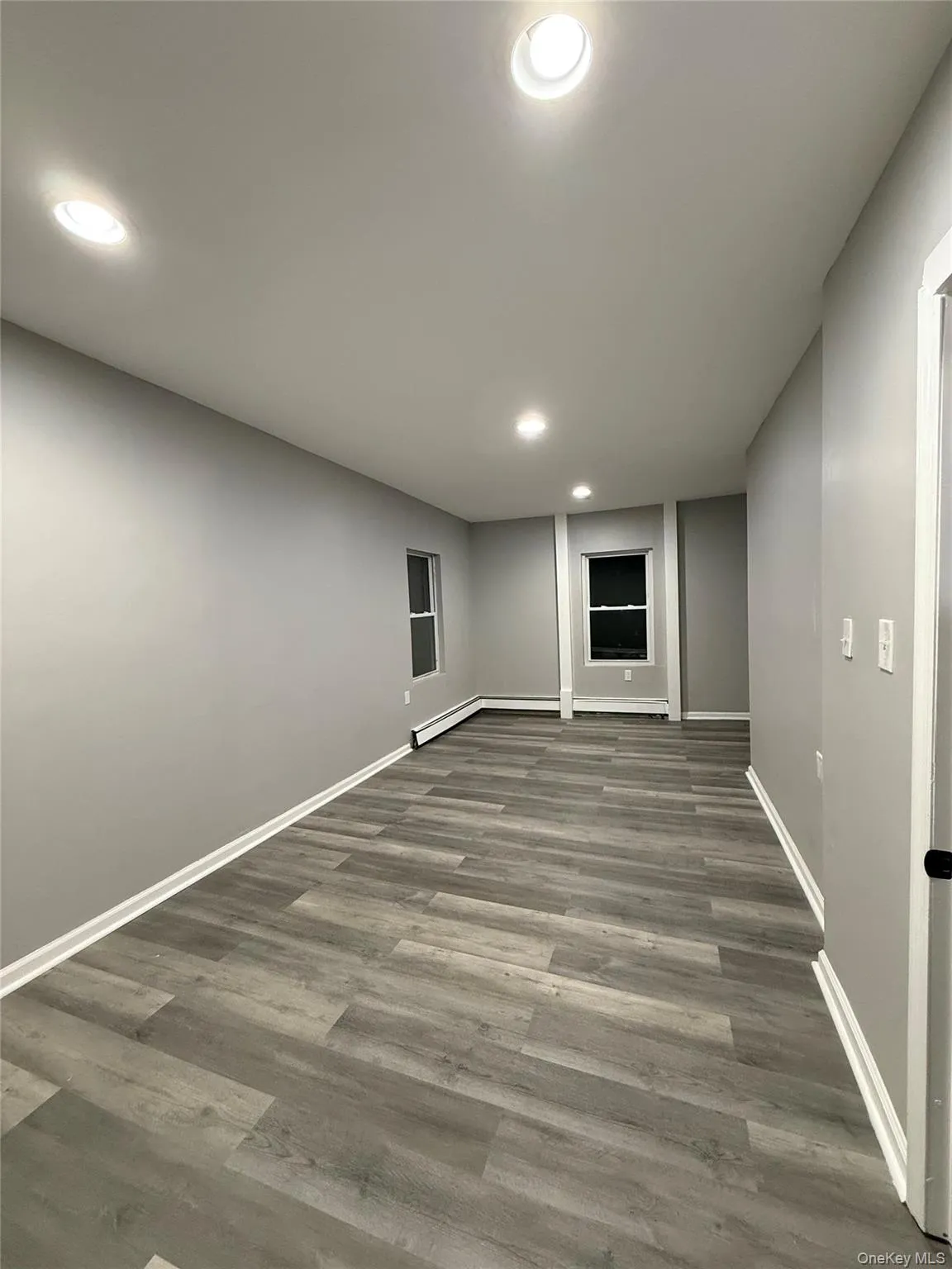 Basement featuring recessed lighting and wood finished floors Basement featuring recessed lighting and wood finished floors