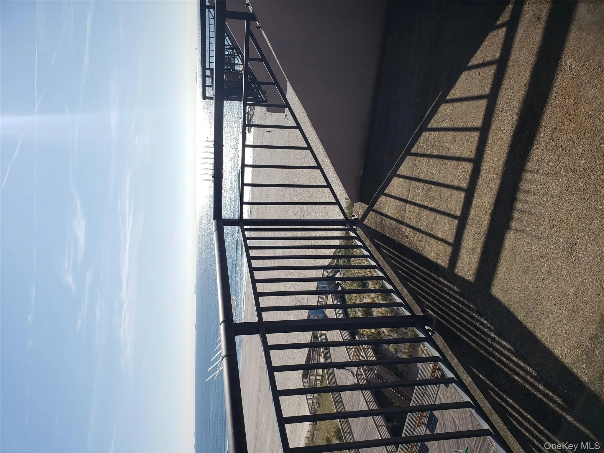 Balcony with view of water and beach Balcony with view of water and beach