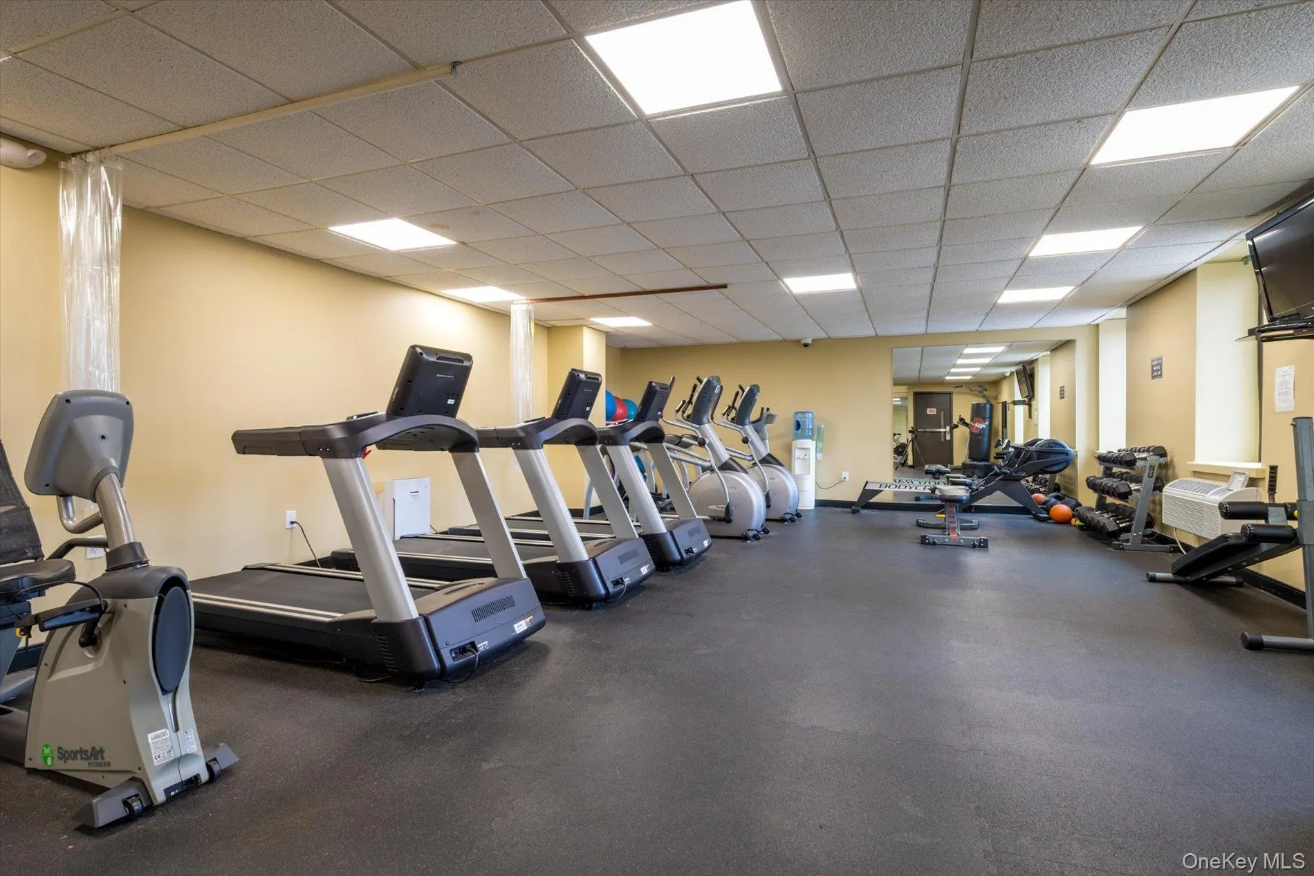 Exercise room featuring a paneled ceiling Exercise room featuring a paneled ceiling