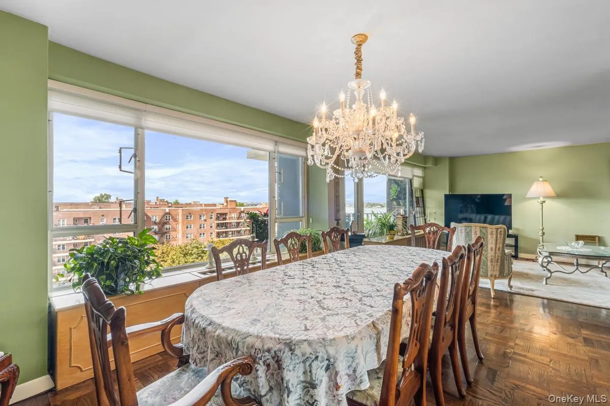 Dining area with baseboards and a chandelier Dining area with baseboards and a chandelier