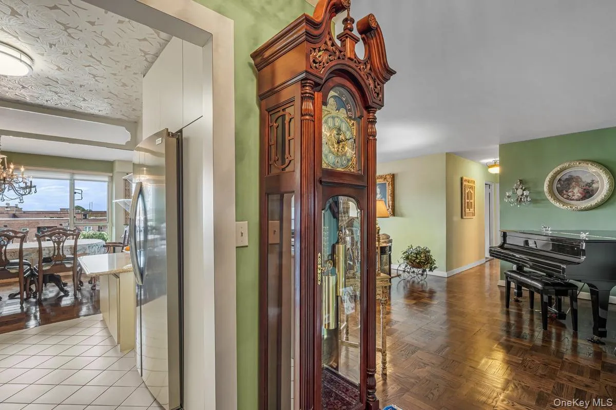 Corridor with a chandelier and baseboards Corridor with a chandelier and baseboards