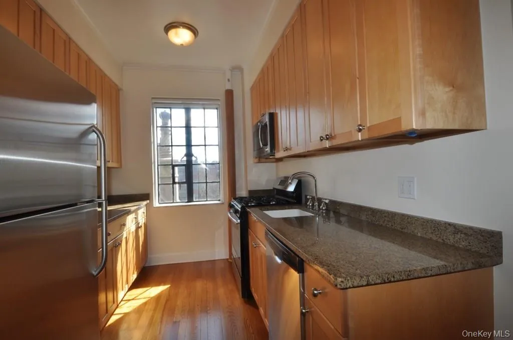 Kitchen with granite counters and stainless steel appliances. There is a large butler pantry that leads to the formal dining room. Kitchen with granite counters and stainless steel appliances. There is a large butler pantry that leads to the formal dining room.