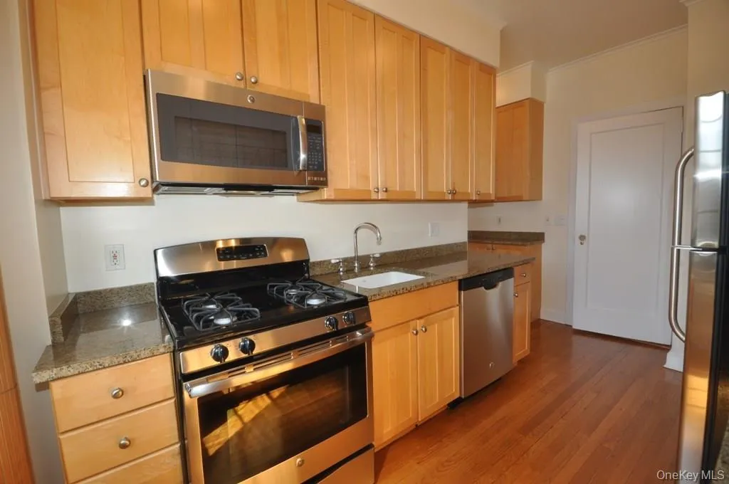 Kitchen with granite counters and stainless steel appliances. There is a large butler pantry that leads to the formal dining room. Kitchen with granite counters and stainless steel appliances. There is a large butler pantry that leads to the formal dining room.