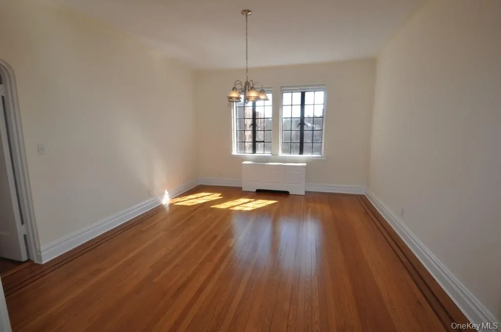Large formal dining room has refinished hardwood floors and arched doorways leading to the large living room and butler pantry. Large formal dining room has refinished hardwood floors and arched doorways leading to the large living room and butler pantry.