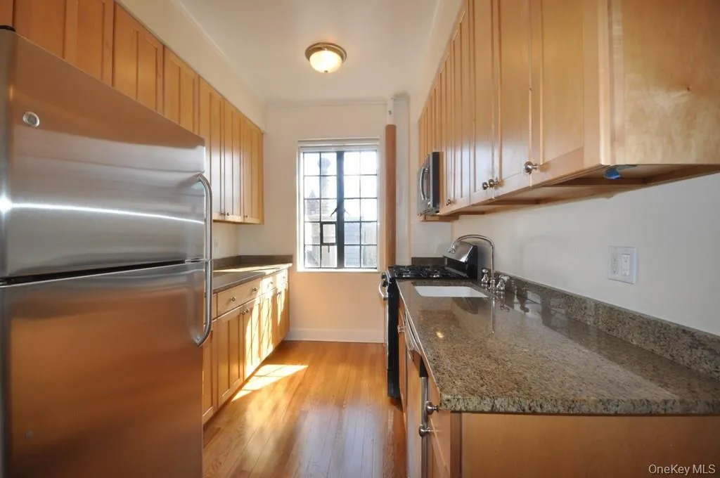 Kitchen with granite counters and stainless steel appliances. There is a large butler pantry that leads to the formal dining room. Kitchen with granite counters and stainless steel appliances. There is a large butler pantry that leads to the formal dining room.