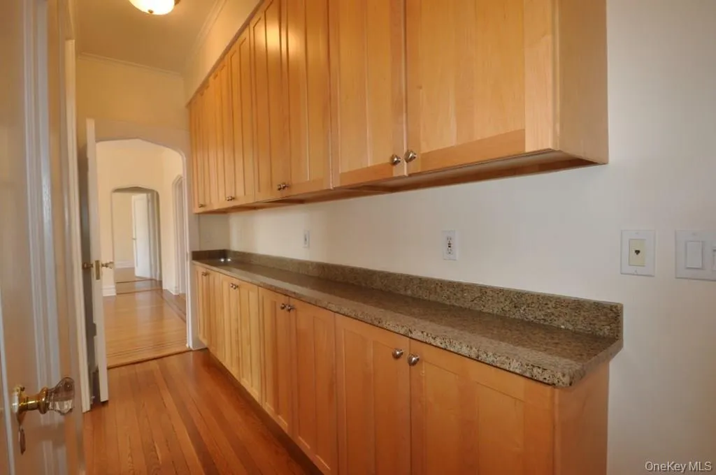 Kitchen with granite counters and stainless steel appliances. There is a large butler pantry that leads to the formal dining room. Kitchen with granite counters and stainless steel appliances. There is a large butler pantry that leads to the formal dining room.