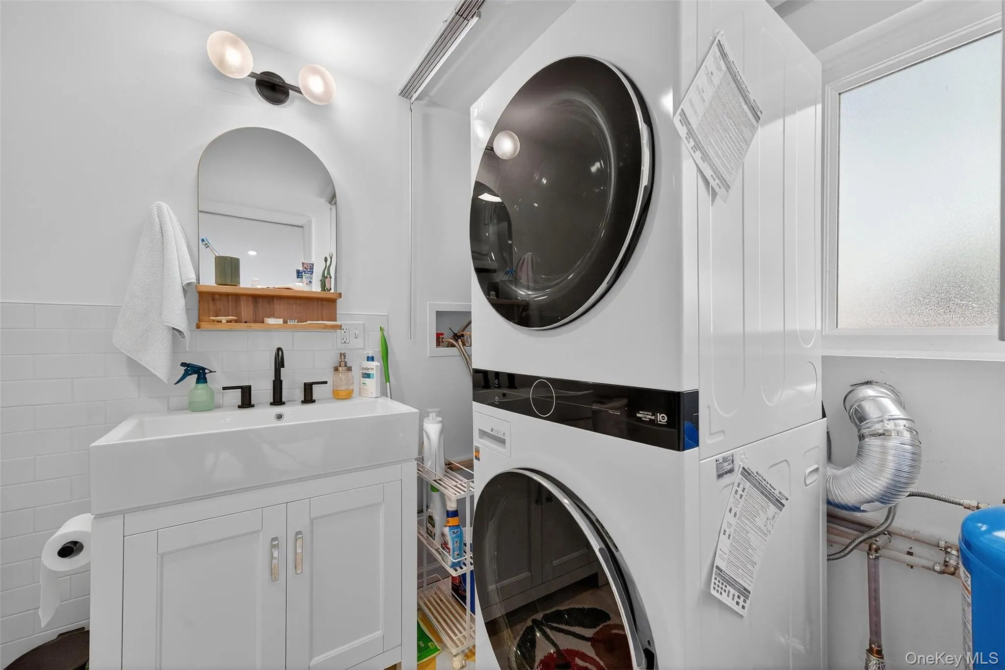 Washer-dryer located in bathroom Washer-dryer located in bathroom