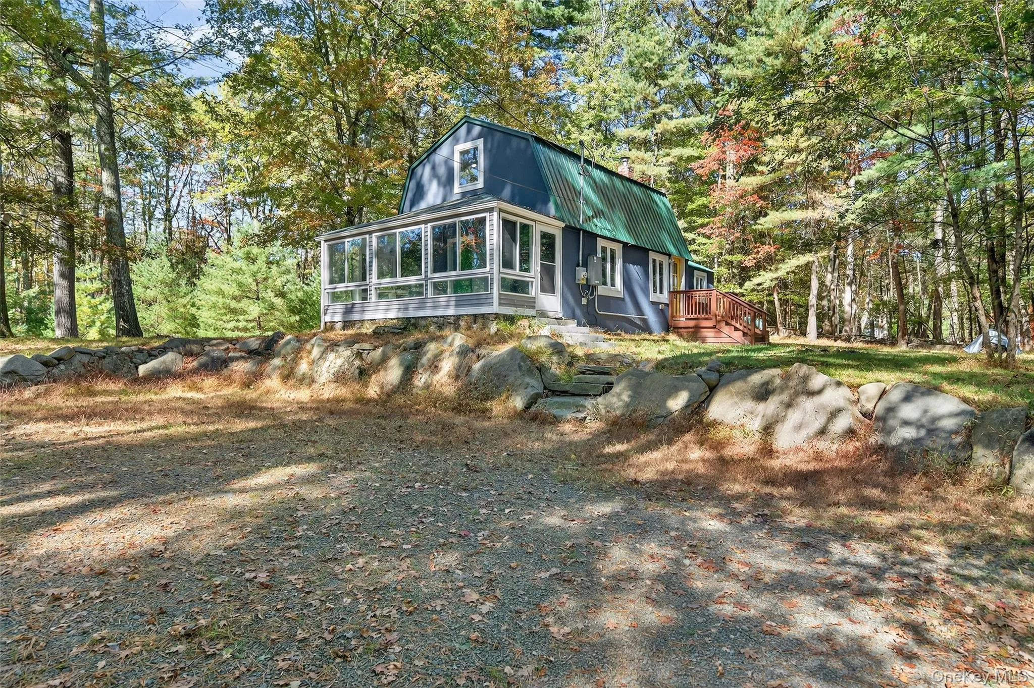 Sunroom view along driveway Sunroom view along driveway