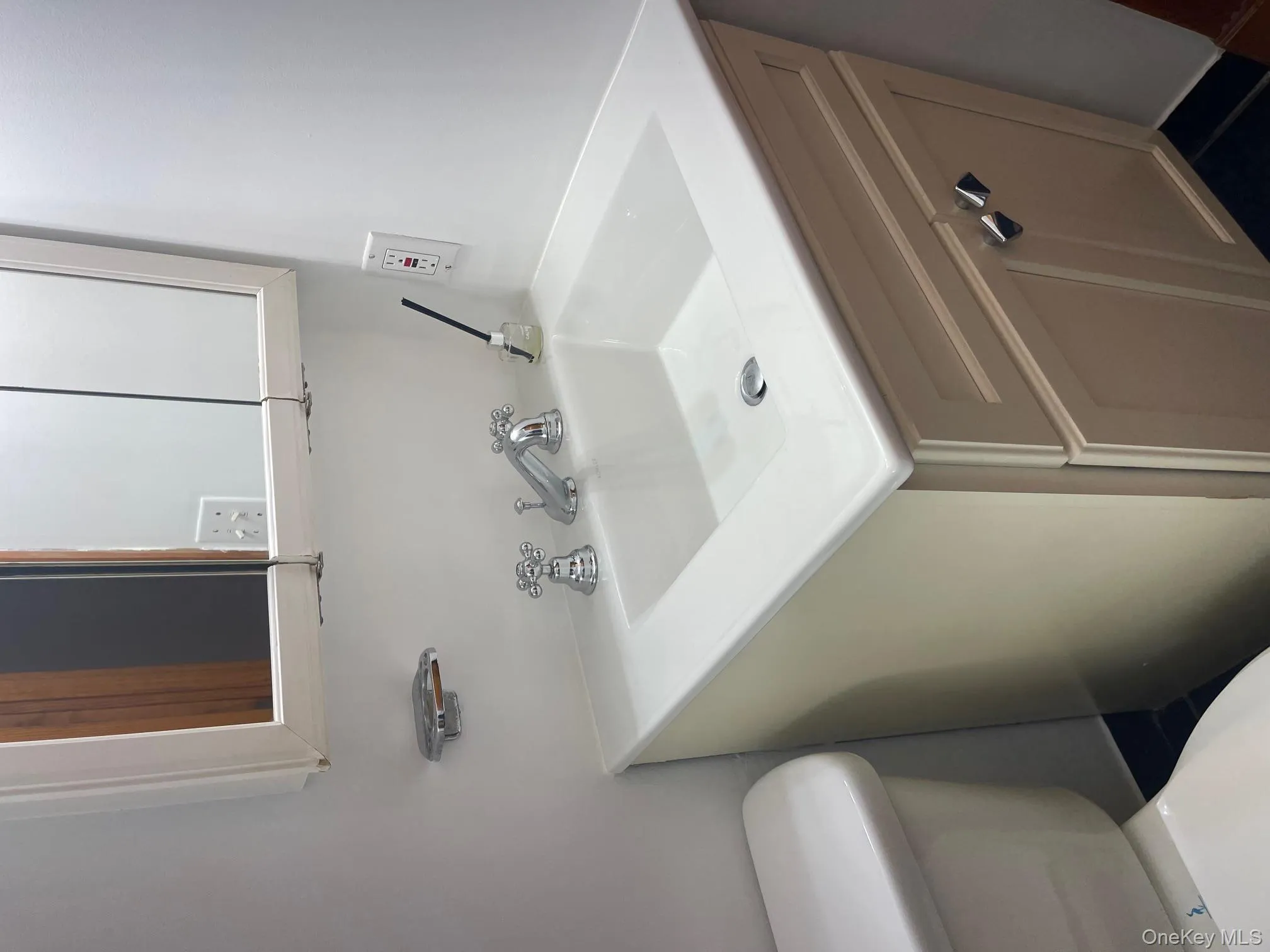 Half bath with vanity and toilet Half bath with vanity and toilet