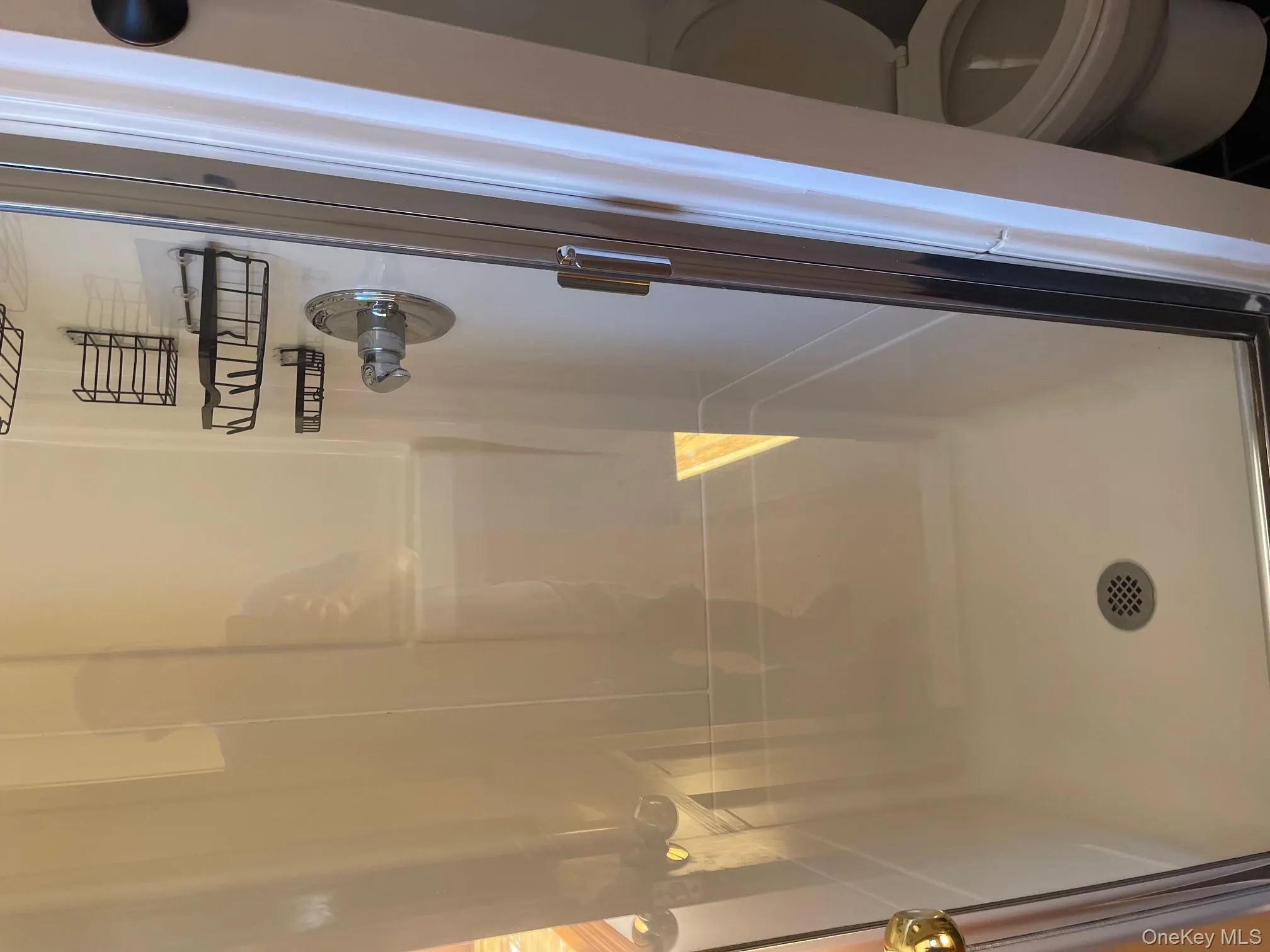 Bathroom with toilet and a shower stall Bathroom with toilet and a shower stall