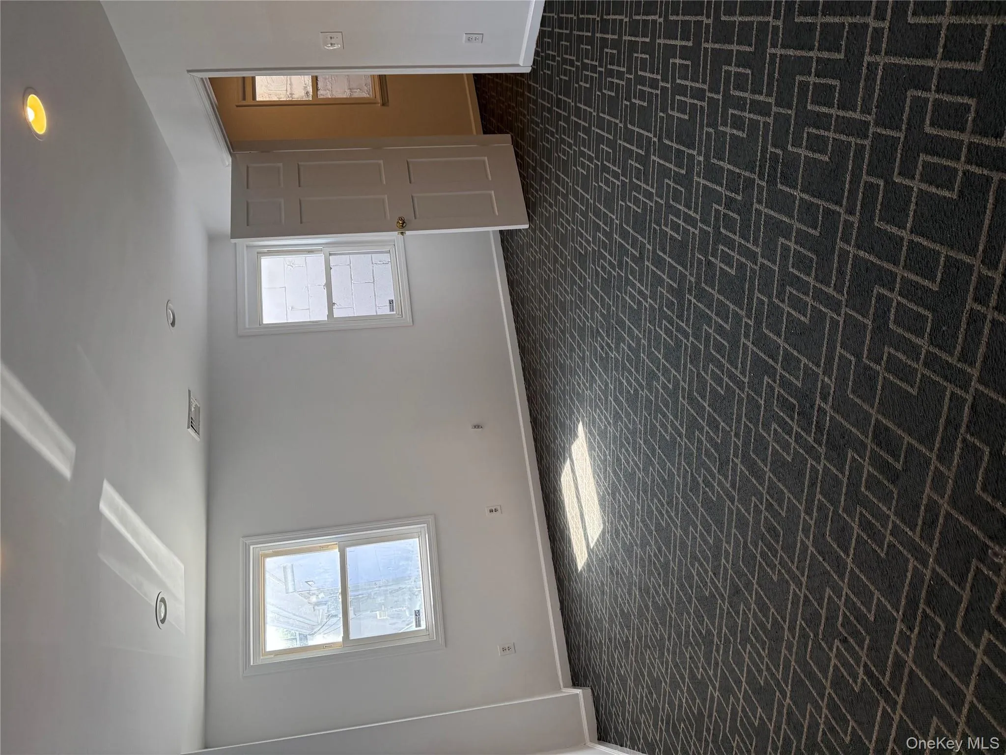 Unfurnished room with recessed lighting and brick patterned flooring Unfurnished room with recessed lighting and brick patterned flooring