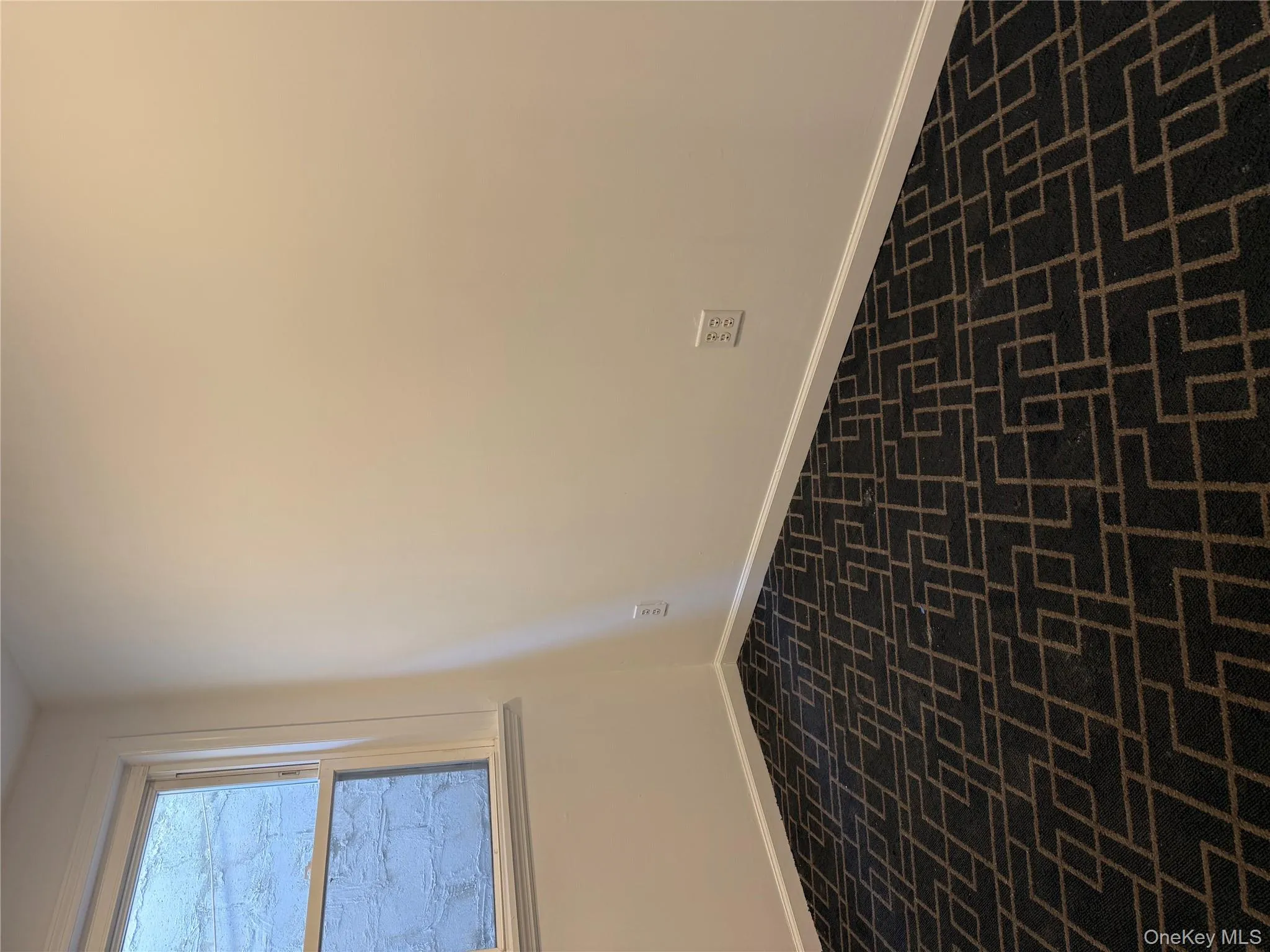 Empty room with brick floors and baseboards Empty room with brick floors and baseboards