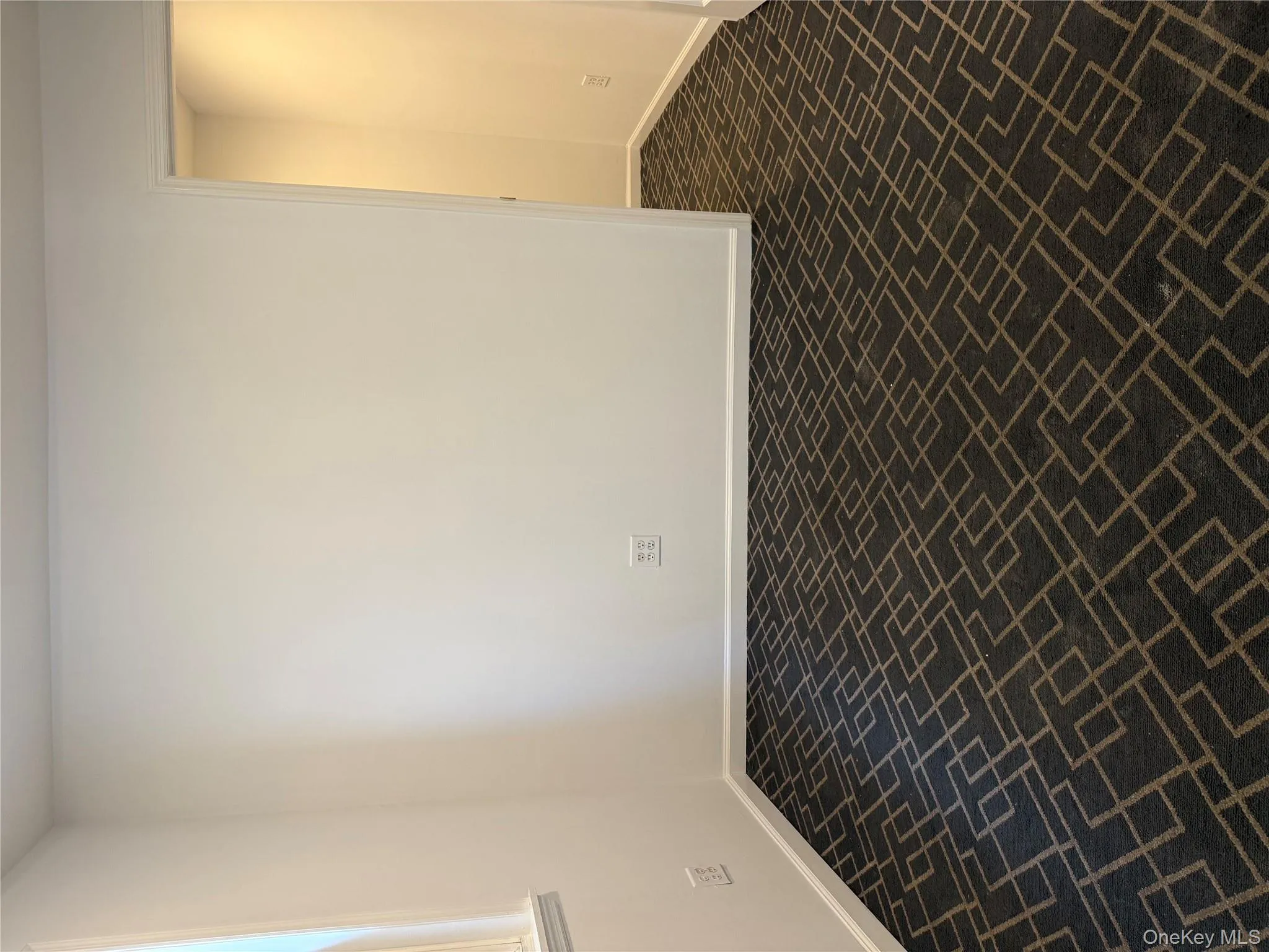 Unfurnished room featuring baseboards and brick patterned floors Unfurnished room featuring baseboards and brick patterned floors