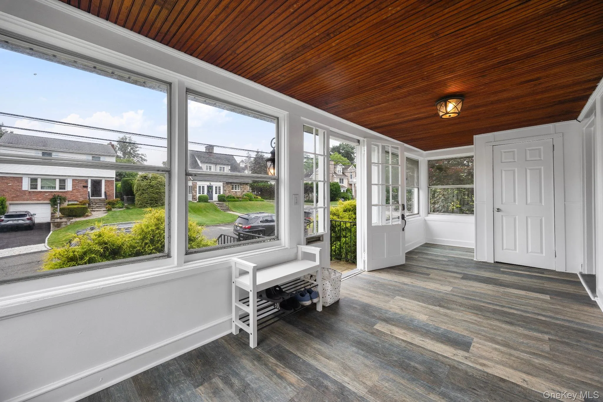 Sunroom with wood ceiling and wood finished floors Sunroom with wood ceiling and wood finished floors