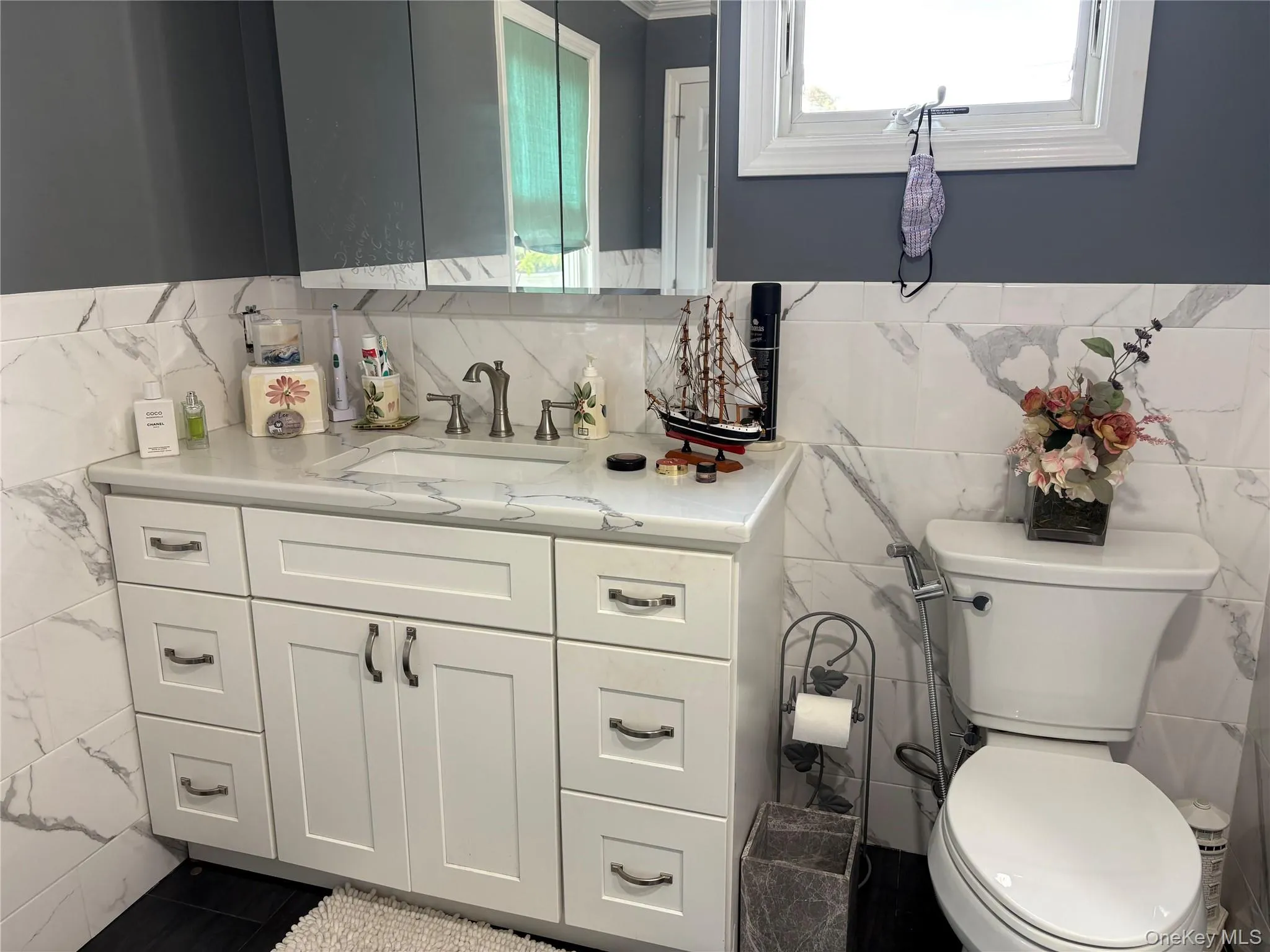 Master bathroom with vanity and tile walls Master bathroom with vanity and tile walls