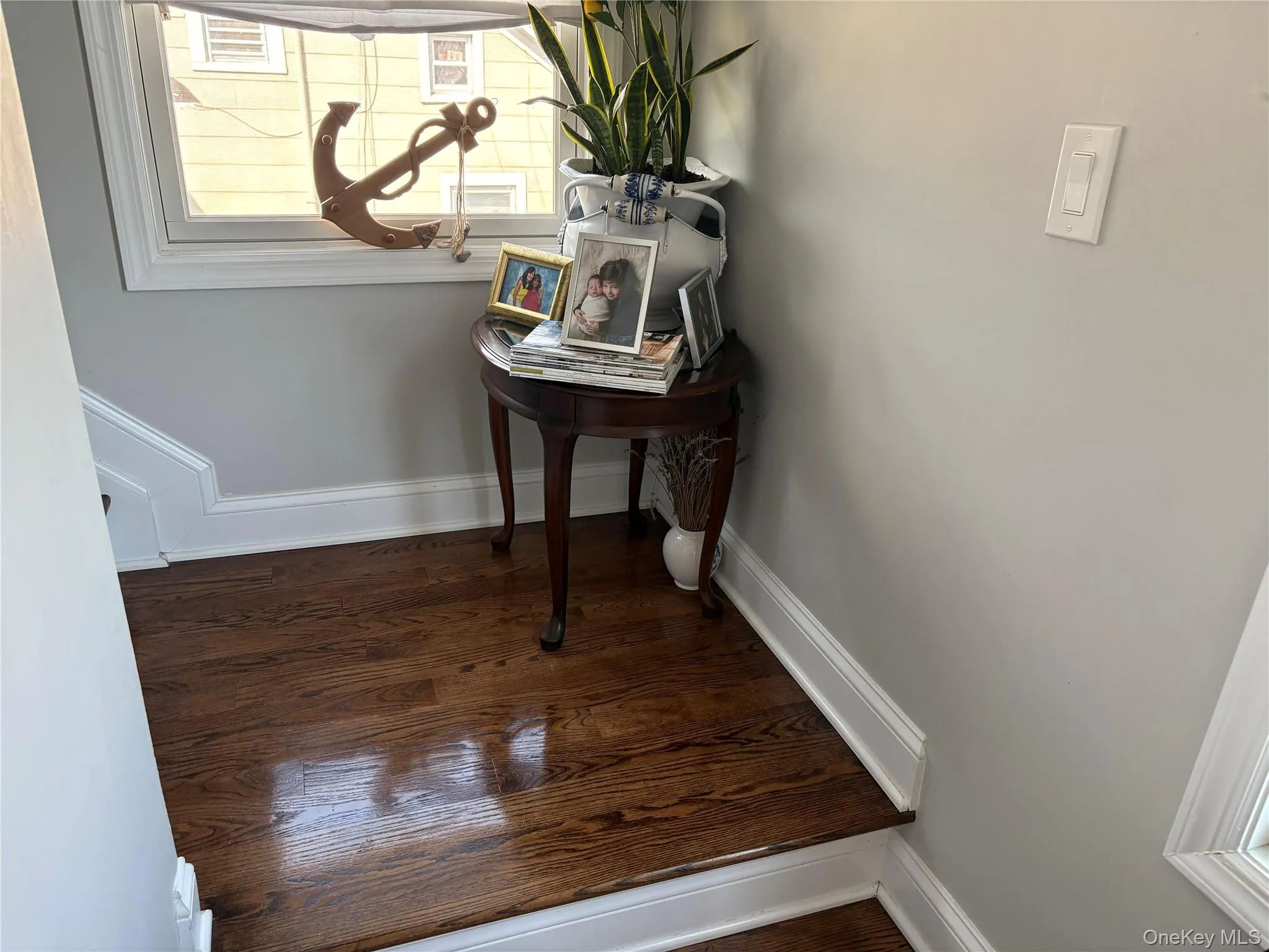Landing with detailed view of hardwood floors Landing with detailed view of hardwood floors
