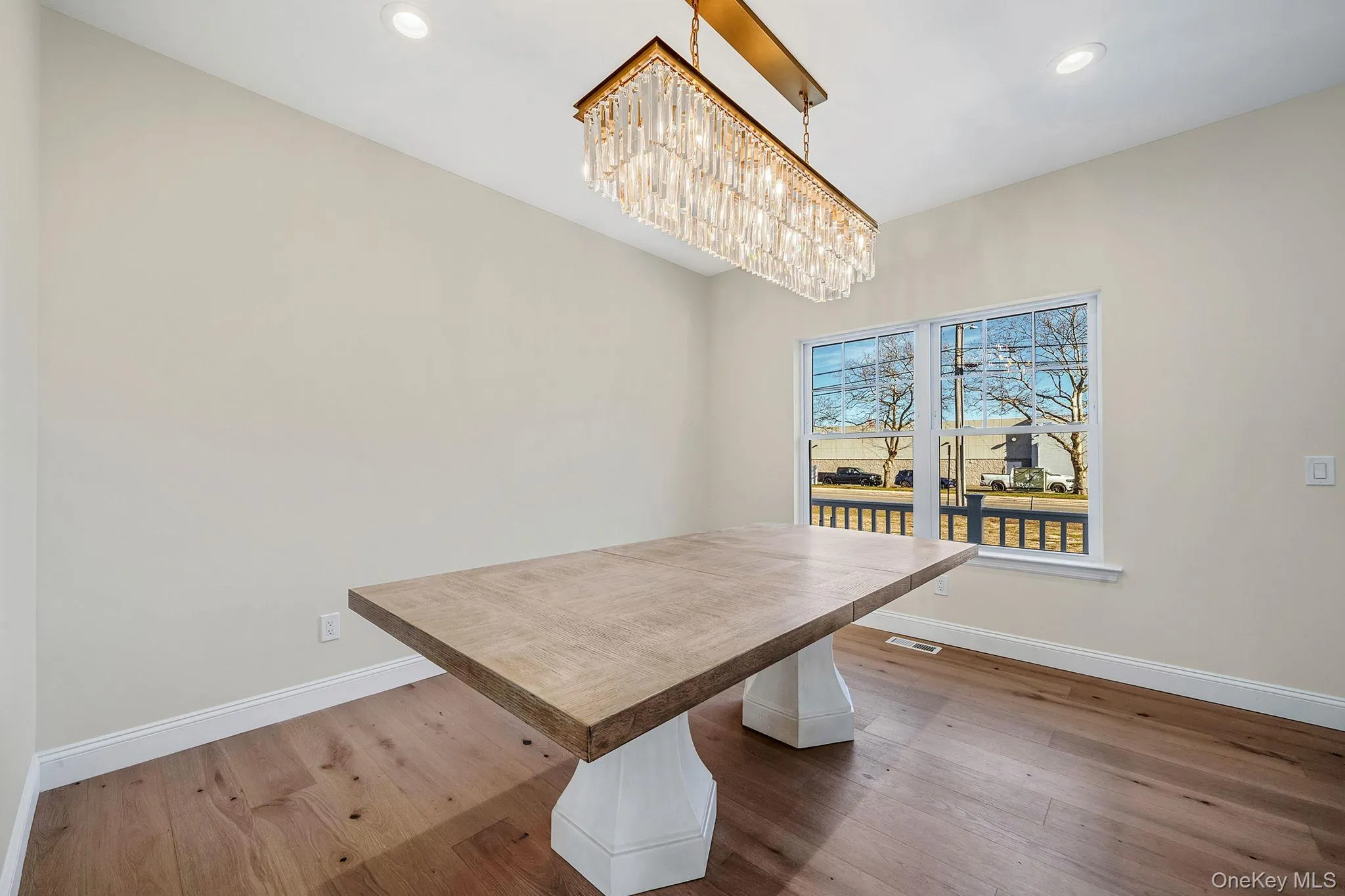 Unfurnished dining area featuring wood-type flooring and recessed lighting Unfurnished dining area featuring wood-type flooring and recessed lighting