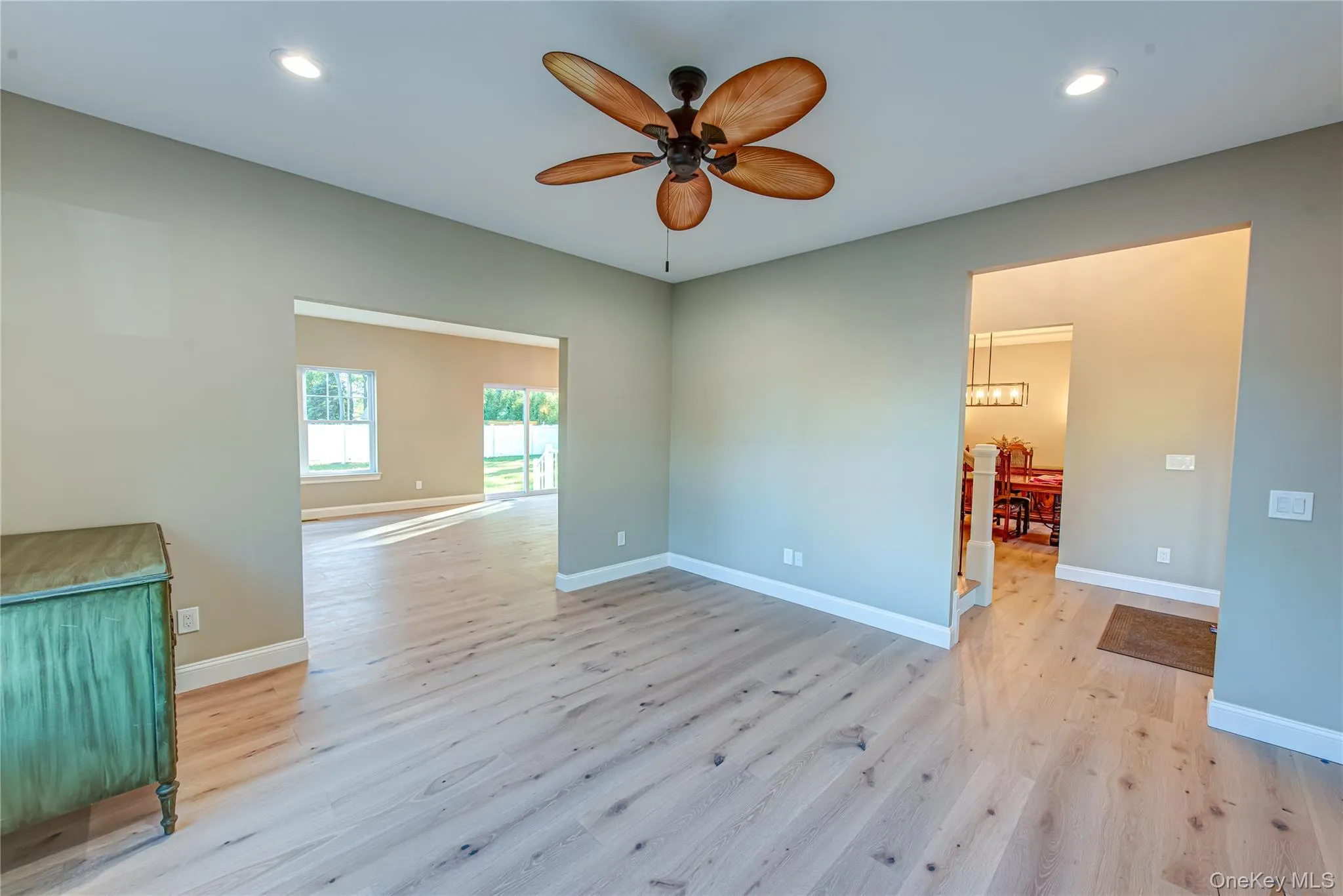 Spare room featuring light wood-type flooring, recessed lighting, and ceiling fan Spare room featuring light wood-type flooring, recessed lighting, and ceiling fan