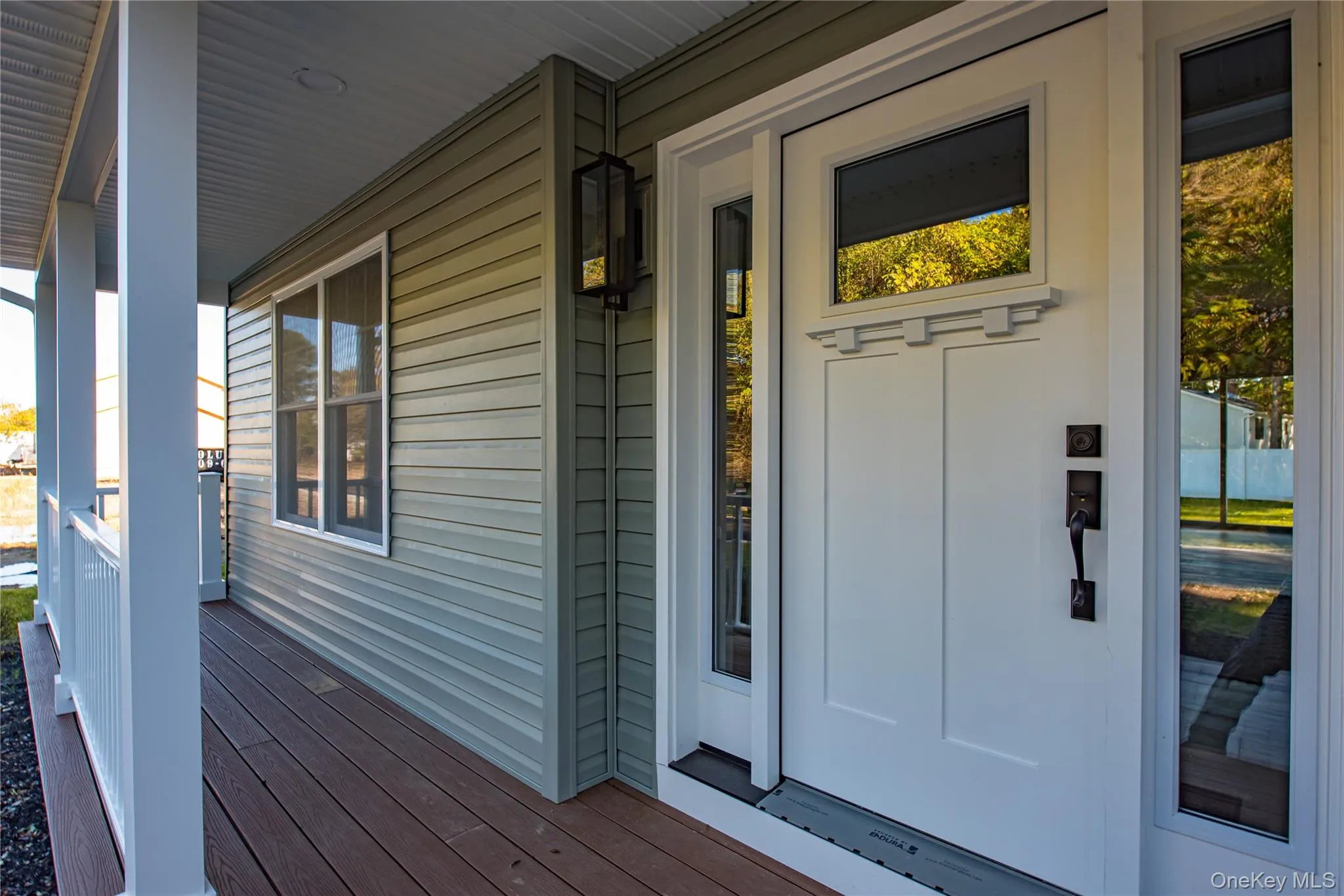 View of exterior entry with a porch View of exterior entry with a porch