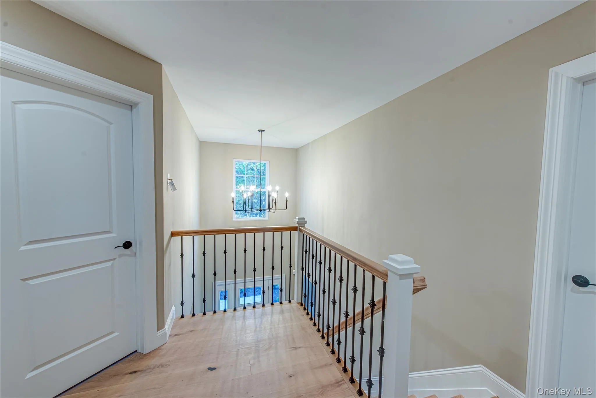 Staircase with a chandelier and baseboards Staircase with a chandelier and baseboards