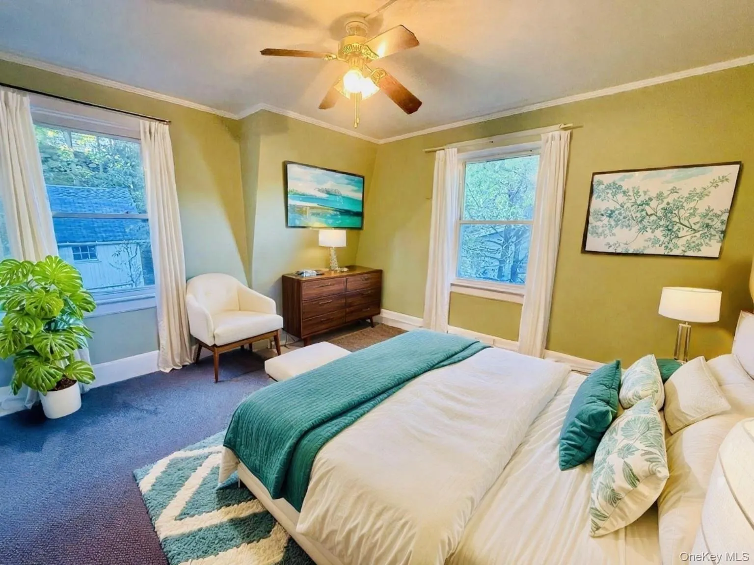 Bedroom with crown molding, carpet floors, and ceiling fan Bedroom with crown molding, carpet floors, and ceiling fan