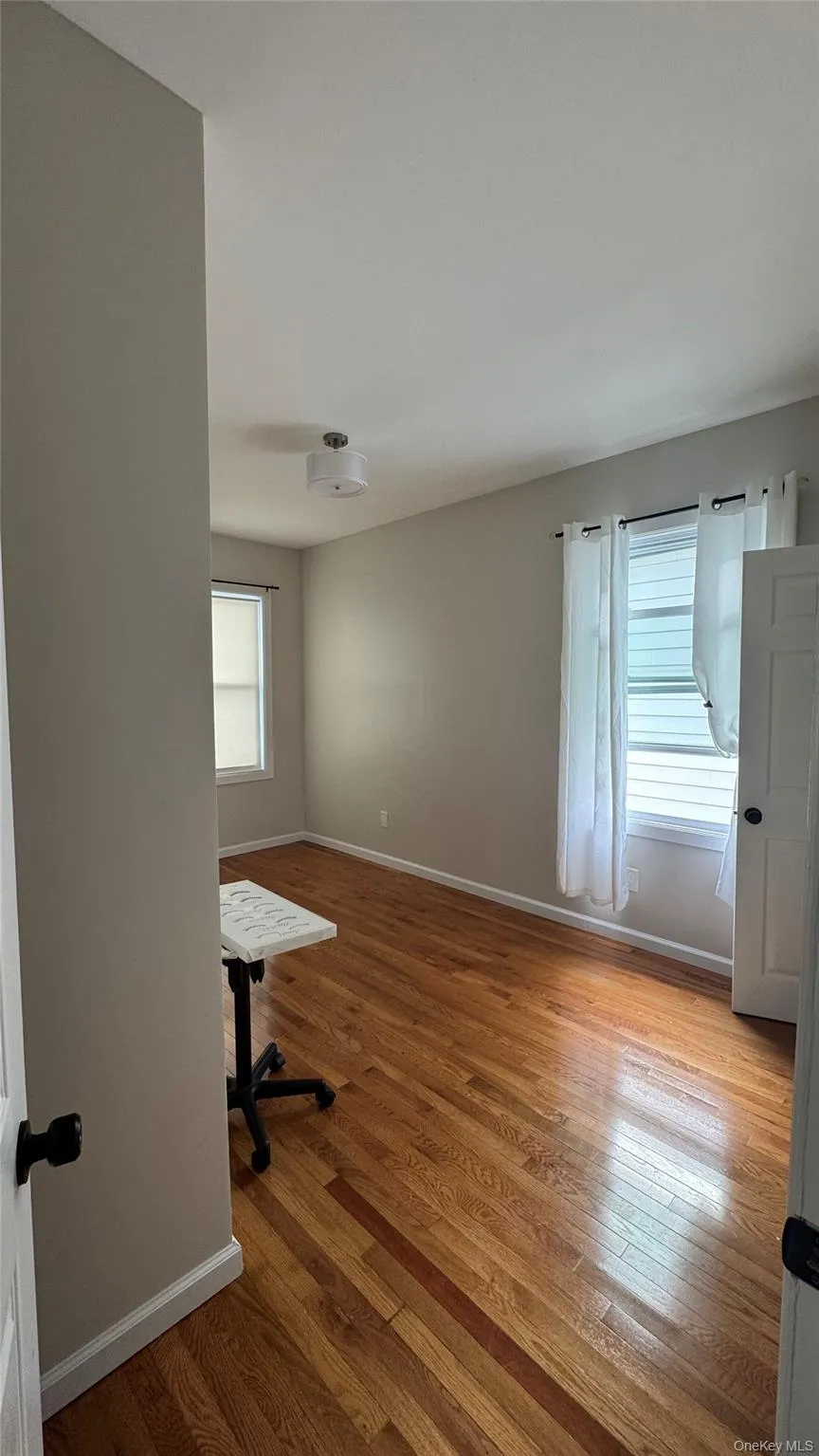 Empty room featuring light wood finished floors Empty room featuring light wood finished floors