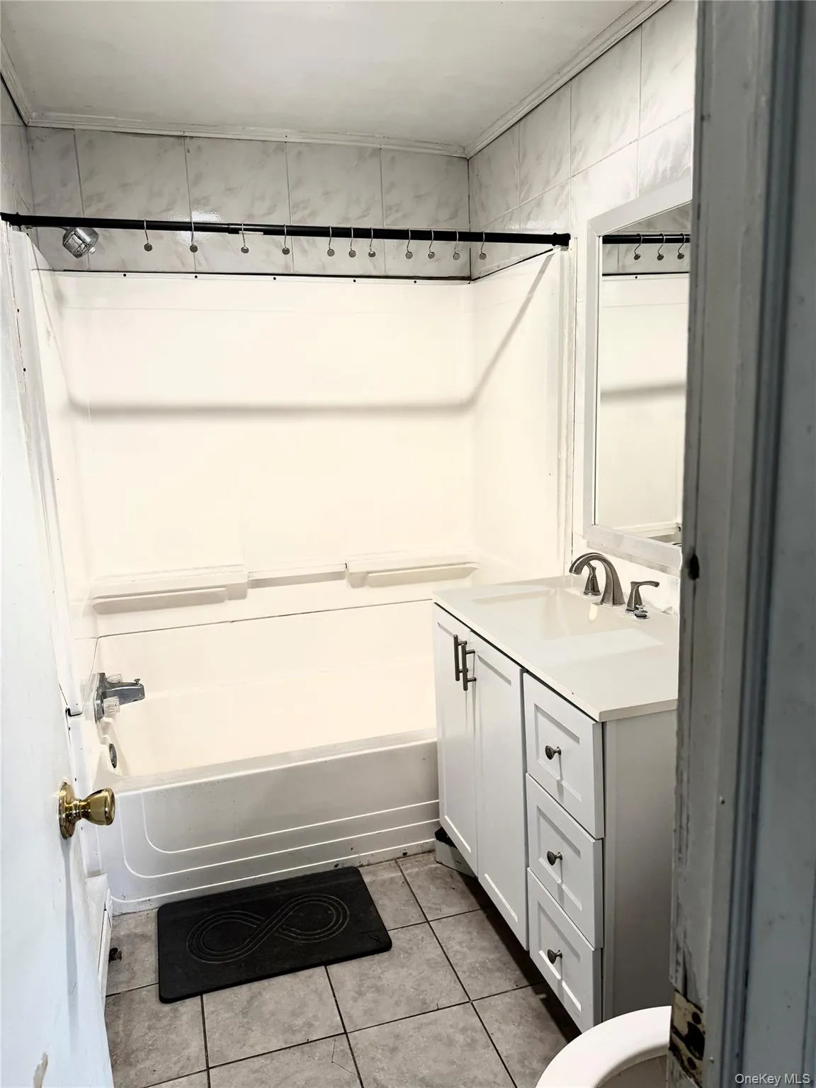 Bathroom with toilet, tile patterned flooring, shower / bathtub combination, and vanity Bathroom with toilet, tile patterned flooring, shower / bathtub combination, and vanity