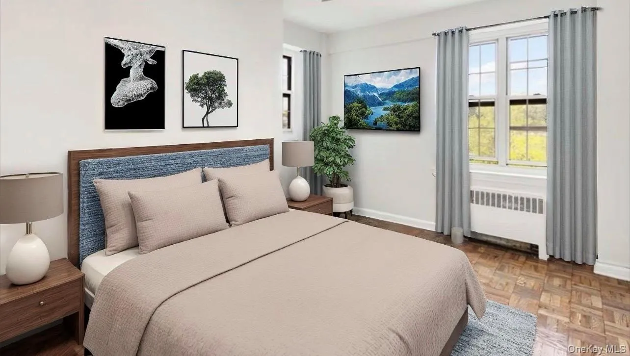 Bedroom featuring radiator heating unit and baseboards Bedroom featuring radiator heating unit and baseboards
