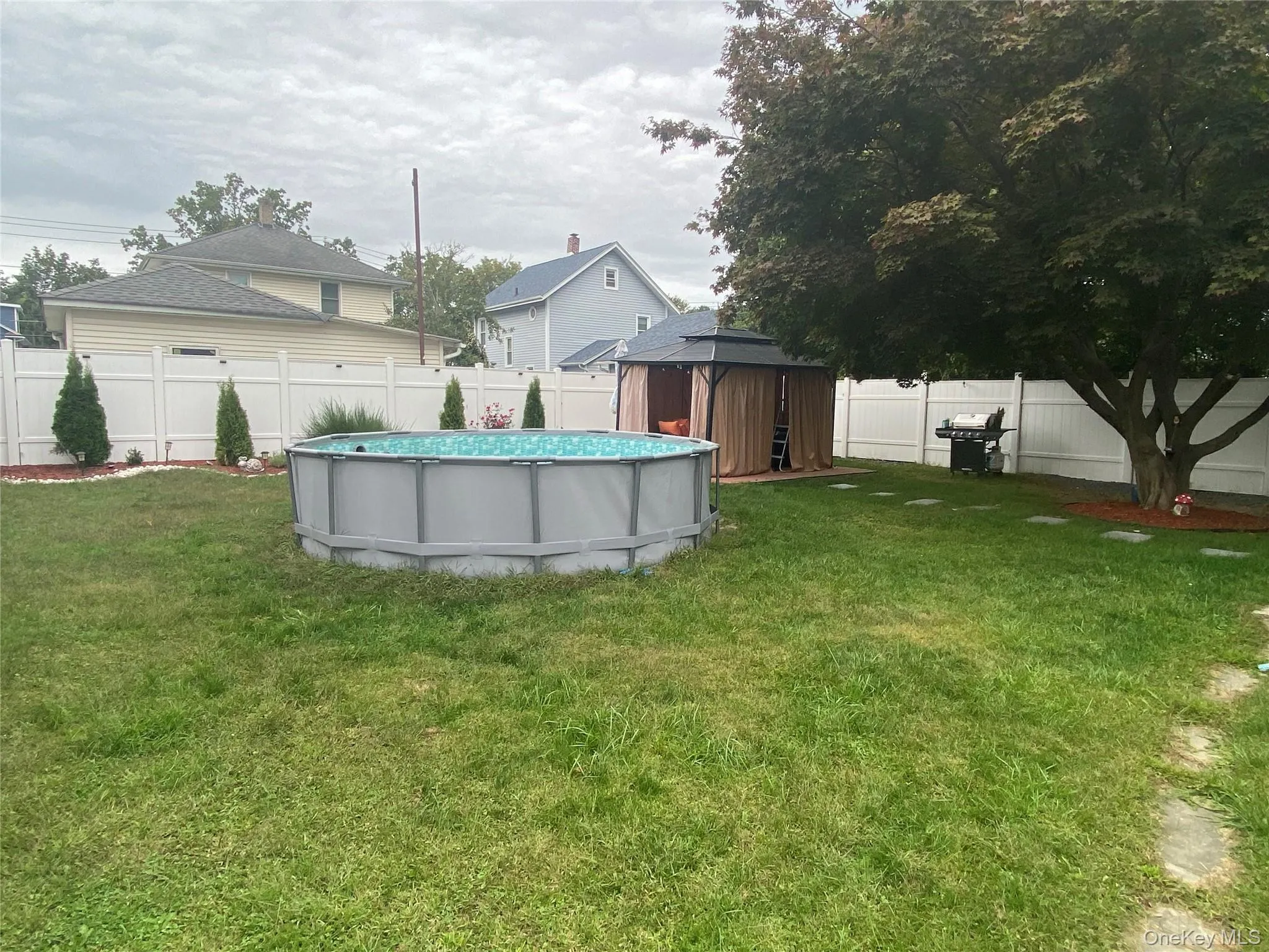 Fenced backyard with a shed Fenced backyard with a shed