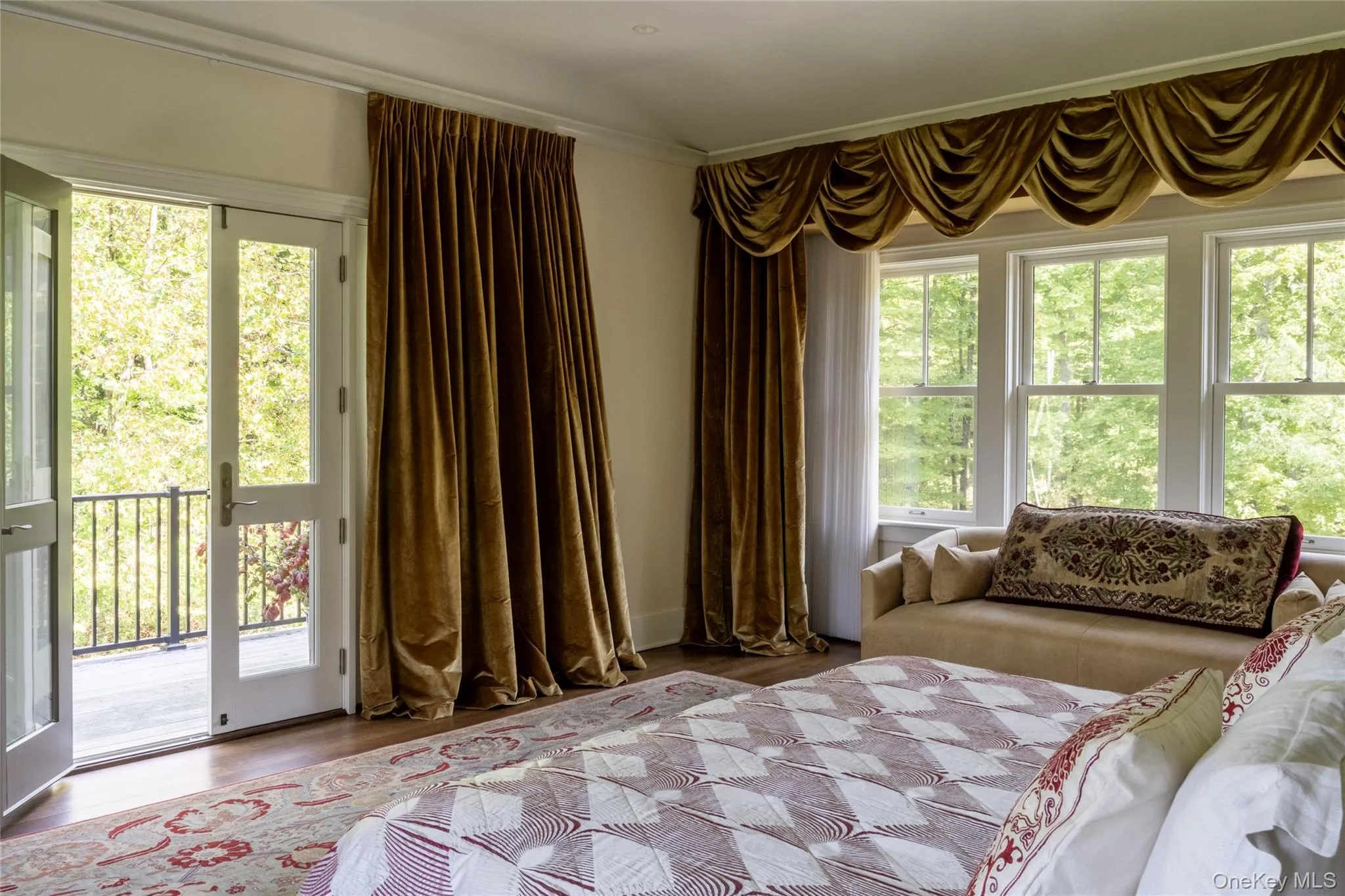 Bedroom featuring wood finished floors and access to outside Bedroom featuring wood finished floors and access to outside