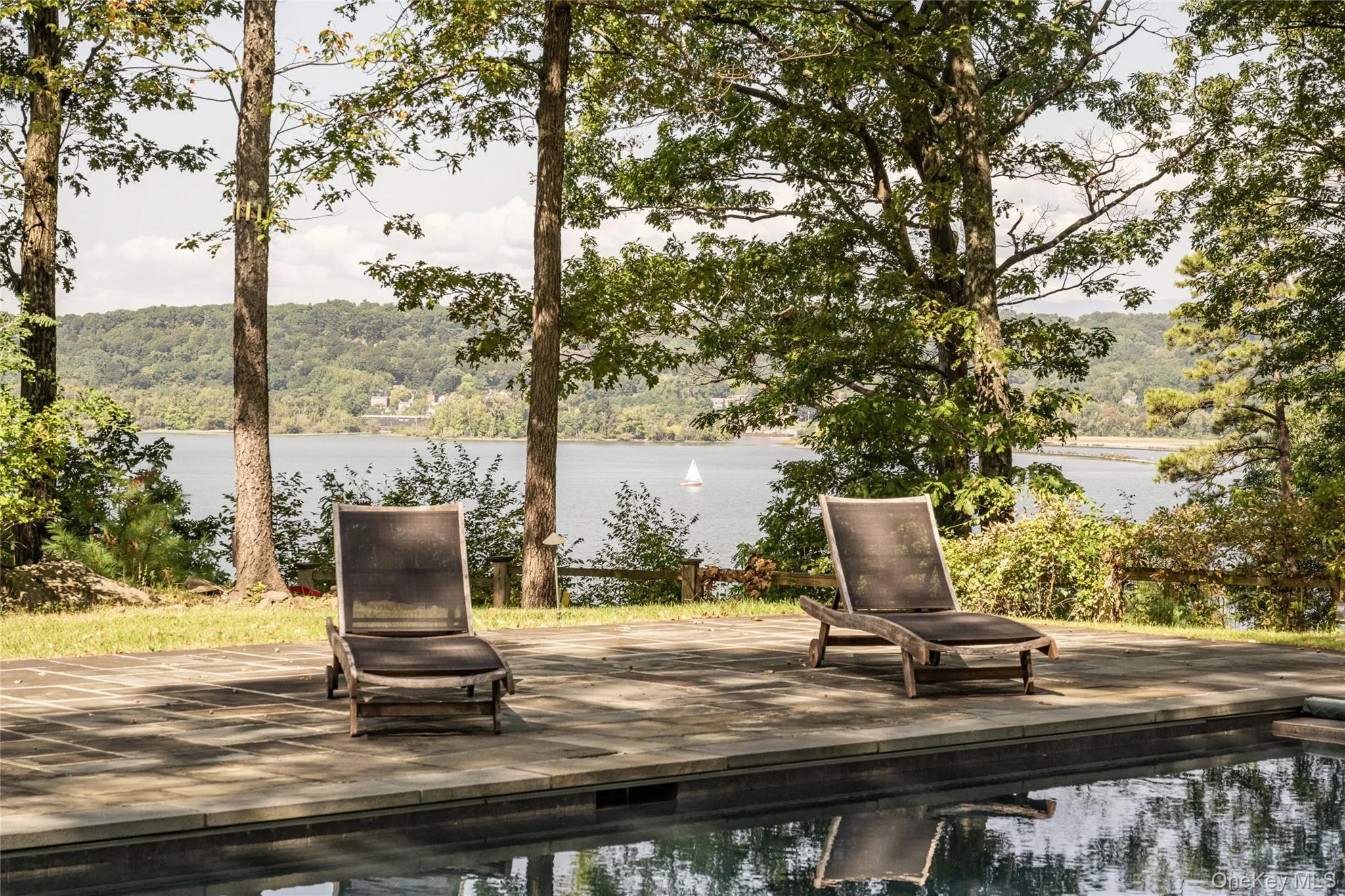 water view and an outdoor pool water view and an outdoor pool