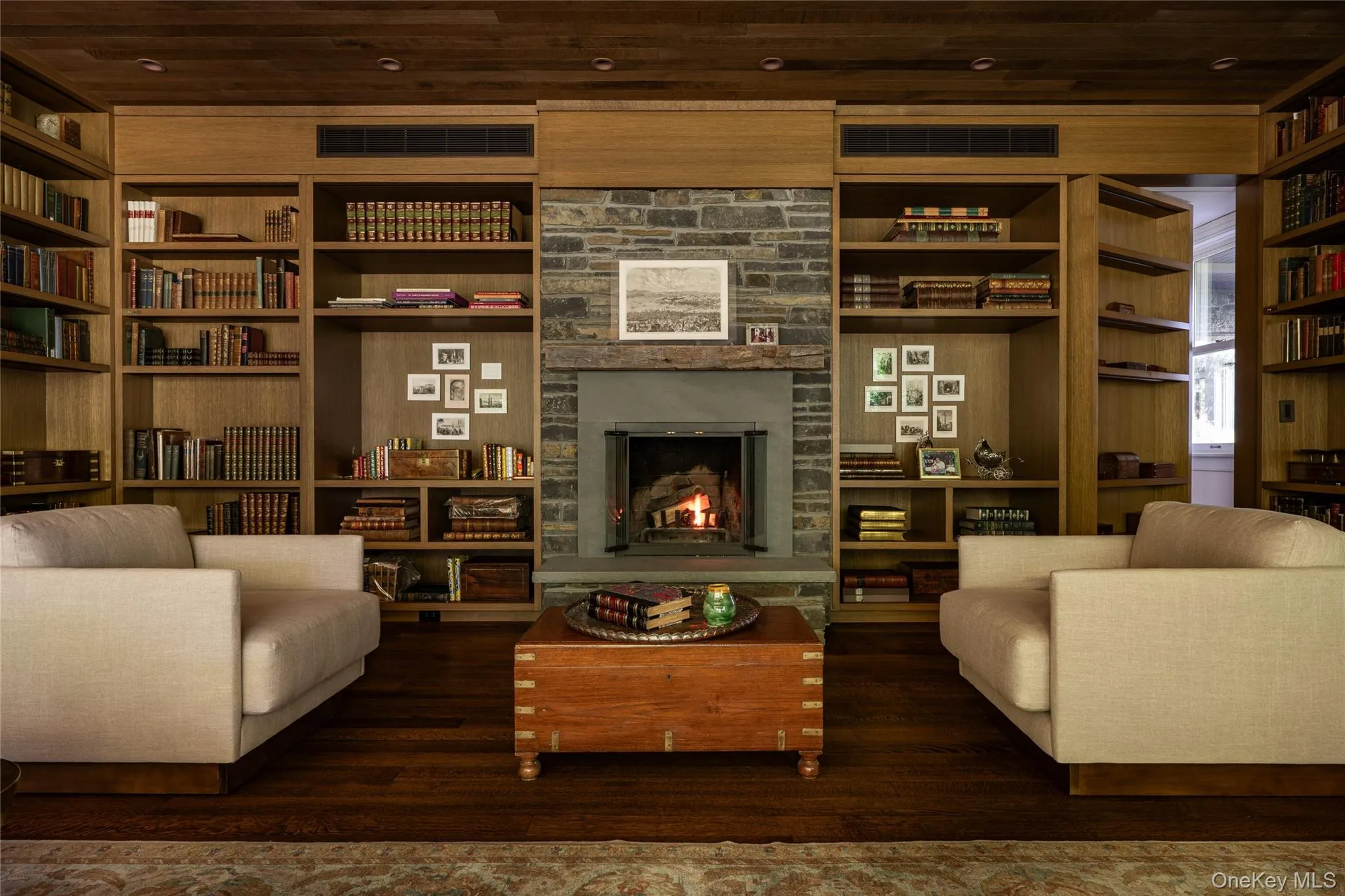 featuring a fireplace, floors, built in shelves, and wood ceiling featuring a fireplace, floors, built in shelves, and wood ceiling