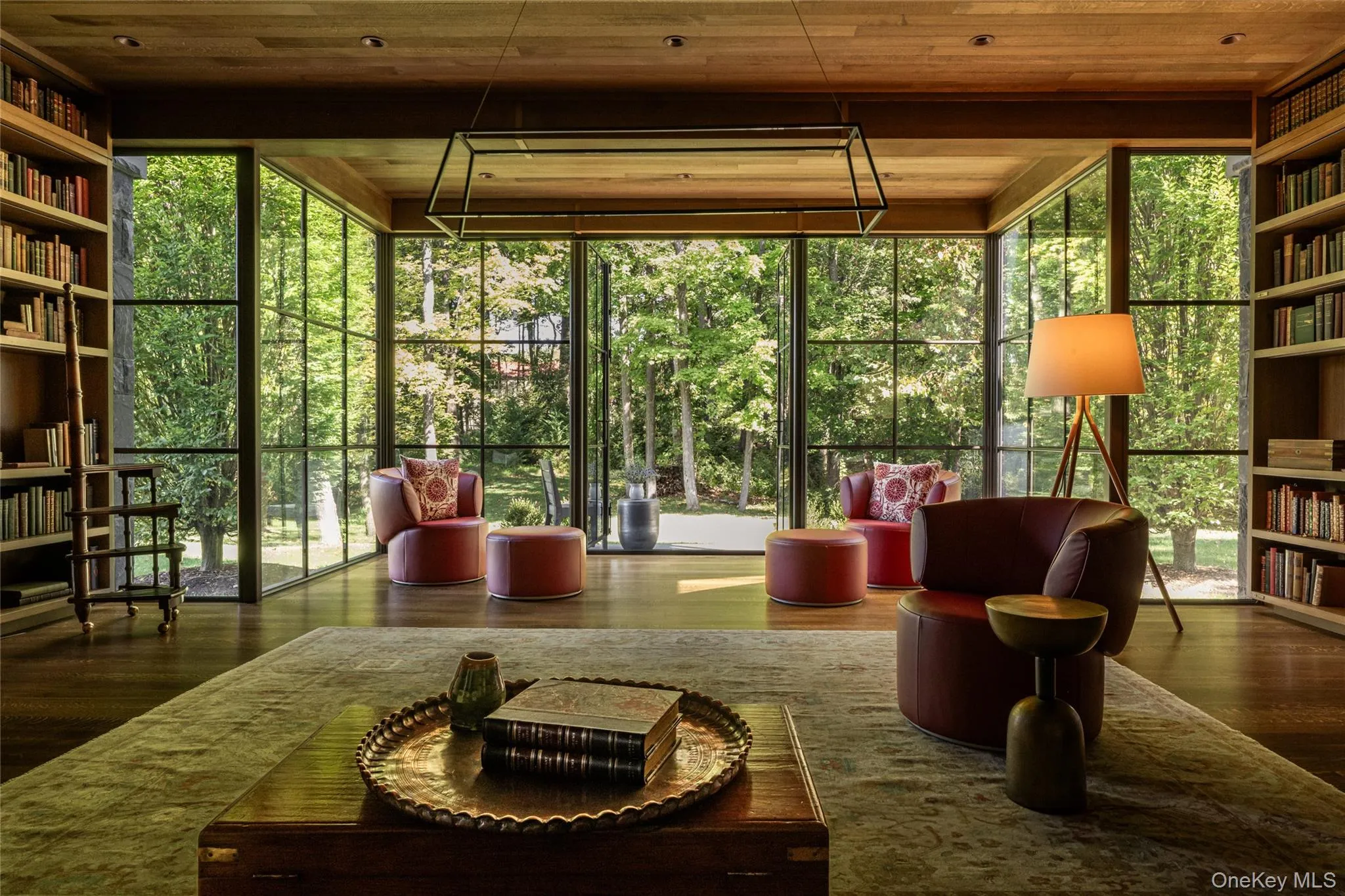 featuring expansive windows and wood ceiling featuring expansive windows and wood ceiling