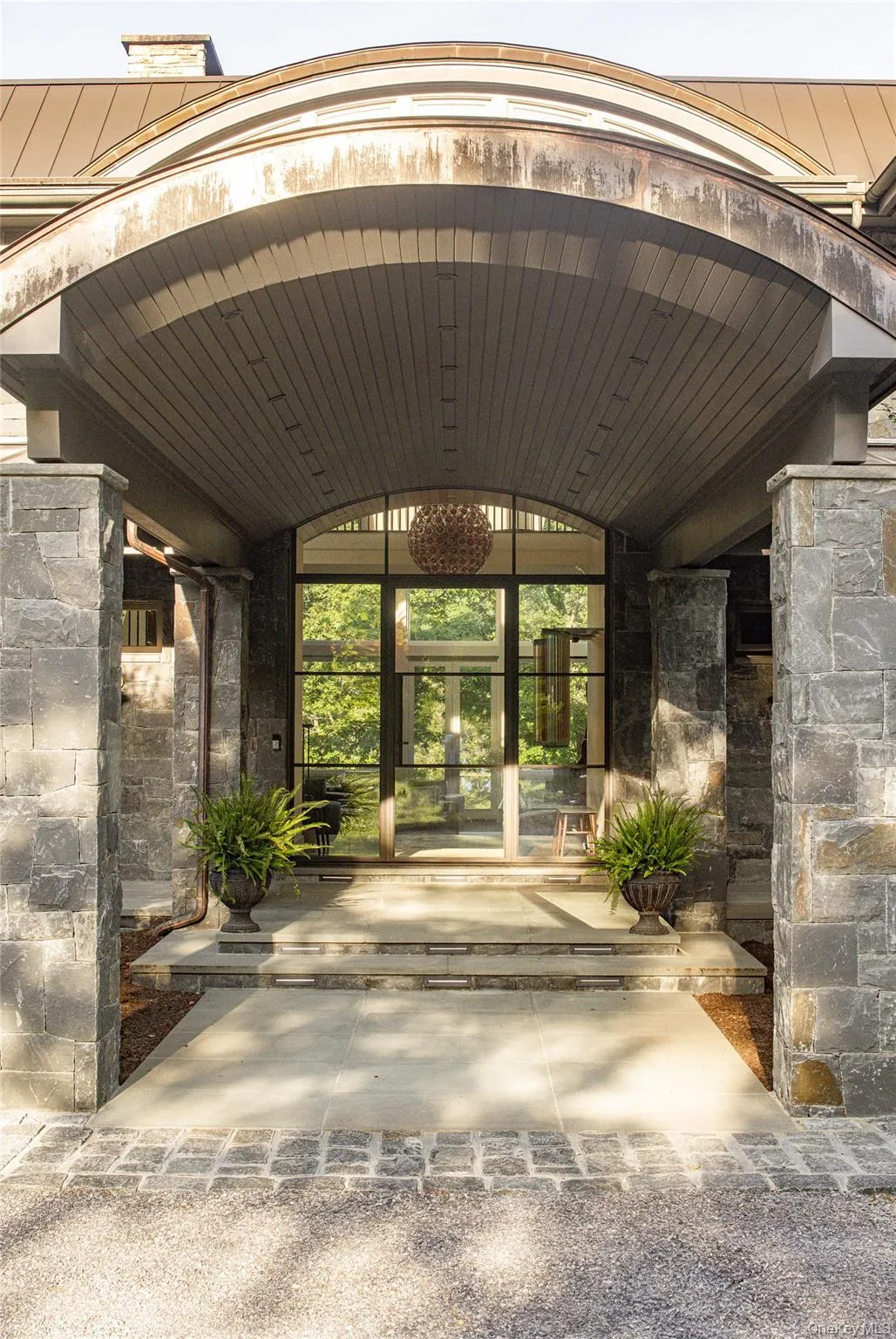 Doorway to property featuring french doors and stone siding Doorway to property featuring french doors and stone siding