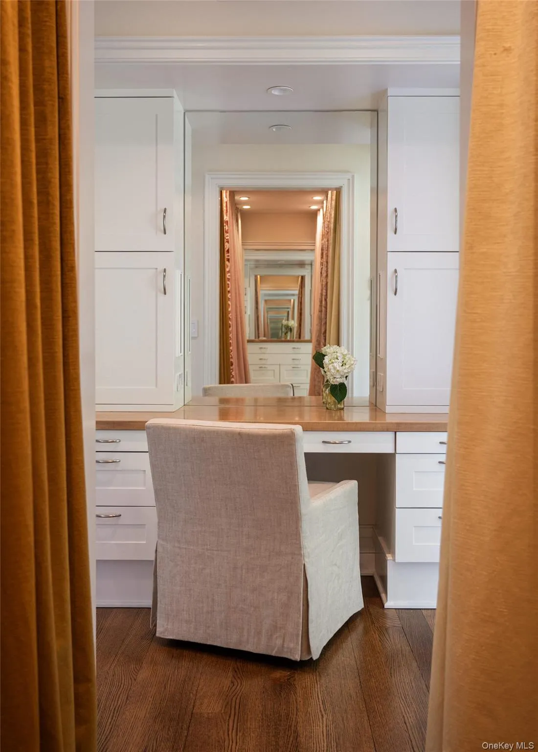 Bathroom with dark wood-style floors and ornamental molding Bathroom with dark wood-style floors and ornamental molding