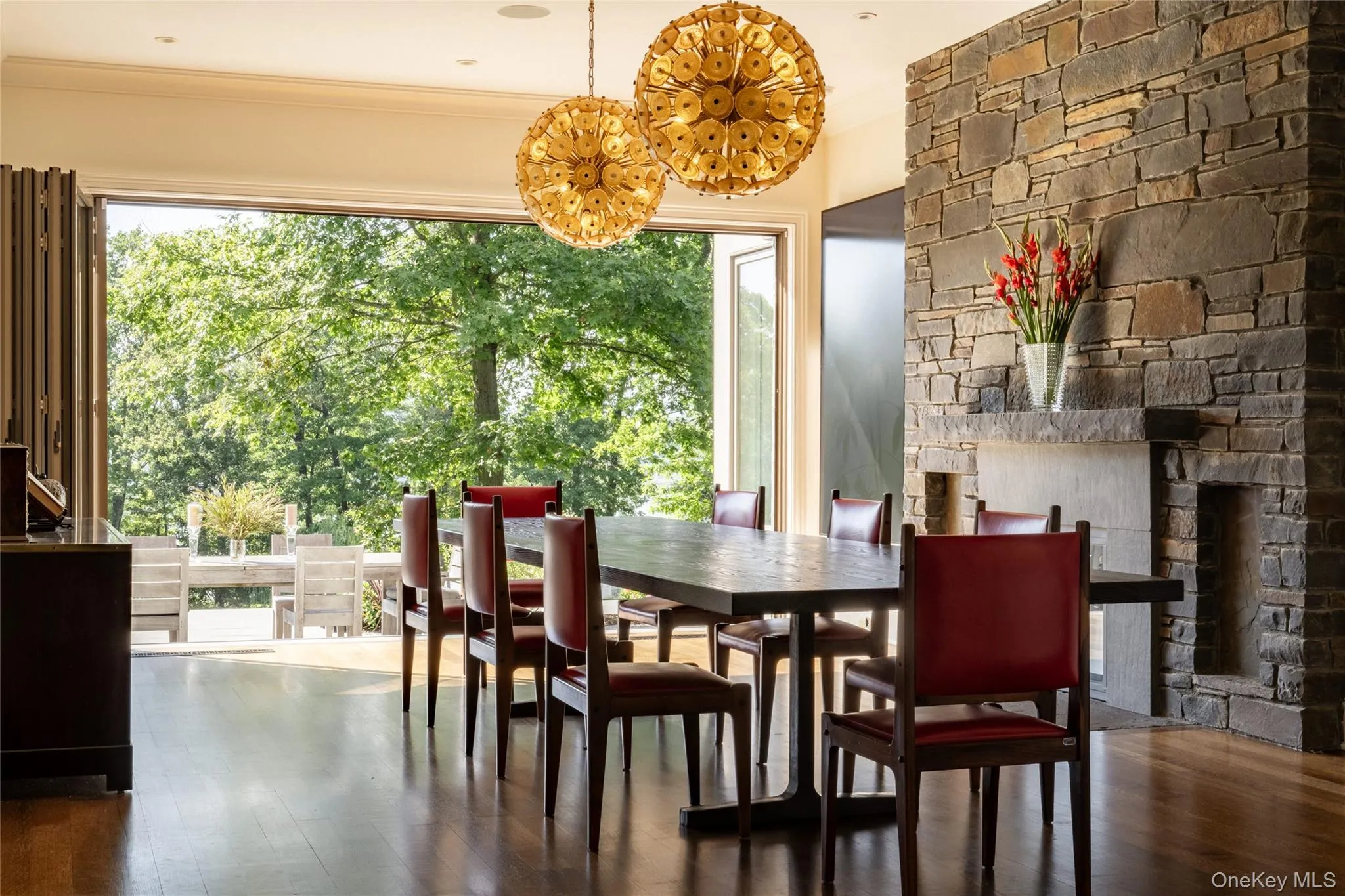 Dining space featuring dark wood-style flooring and ornamental molding Dining space featuring dark wood-style flooring and ornamental molding