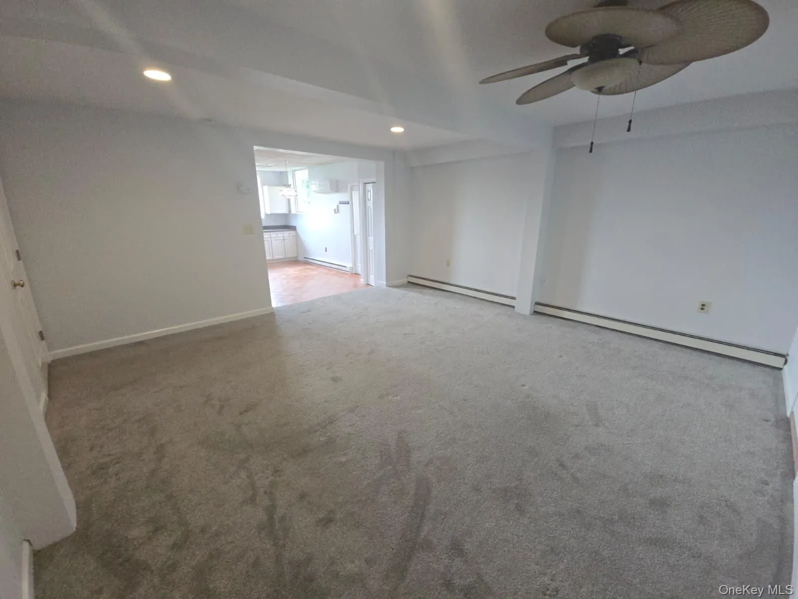 Spare room with recessed lighting, carpet floors, a baseboard radiator, a ceiling fan, and a baseboard heating unit Spare room with recessed lighting, carpet floors, a baseboard radiator, a ceiling fan, and a baseboard heating unit