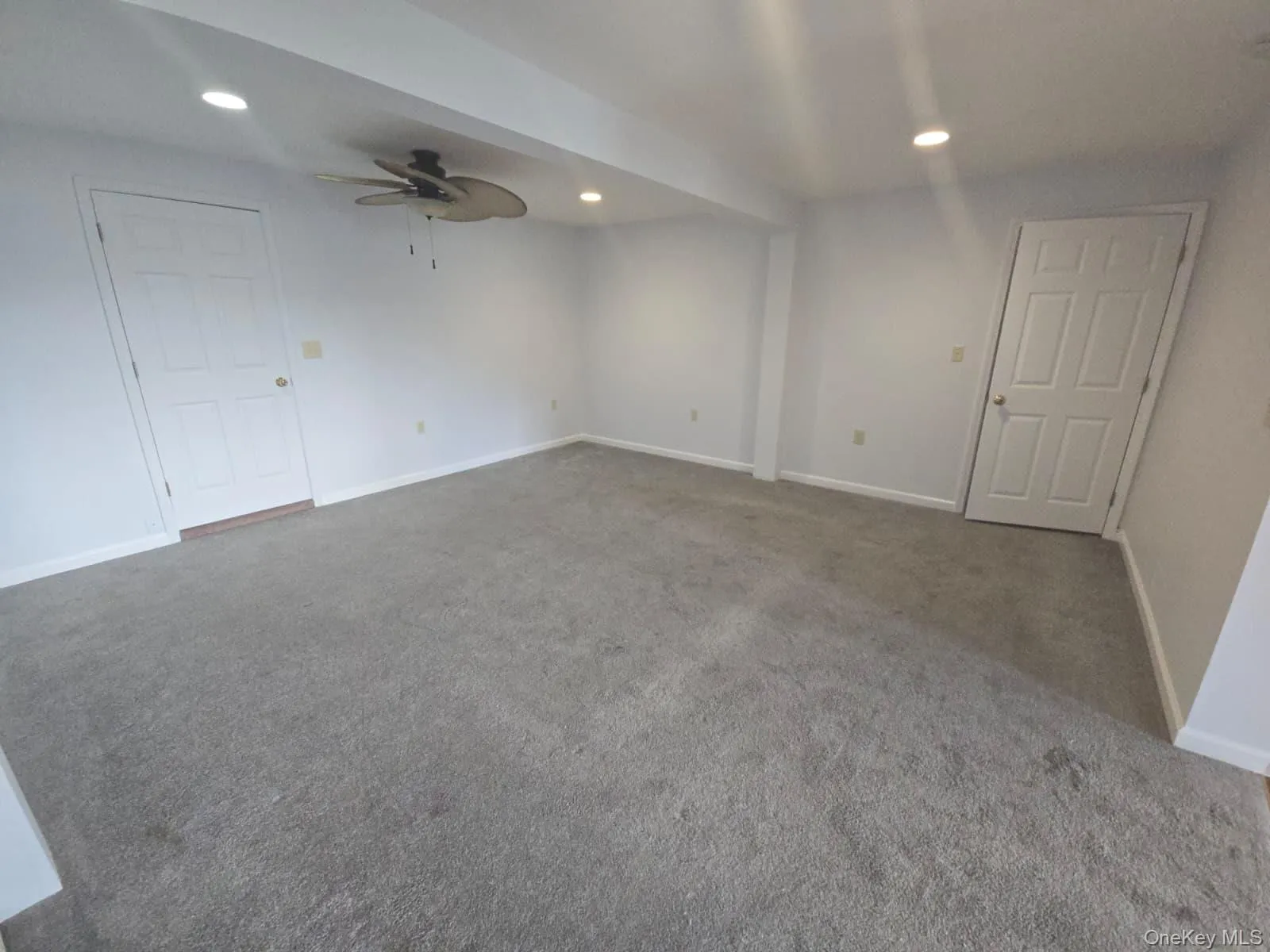 Carpeted empty room with recessed lighting and ceiling fan Carpeted empty room with recessed lighting and ceiling fan