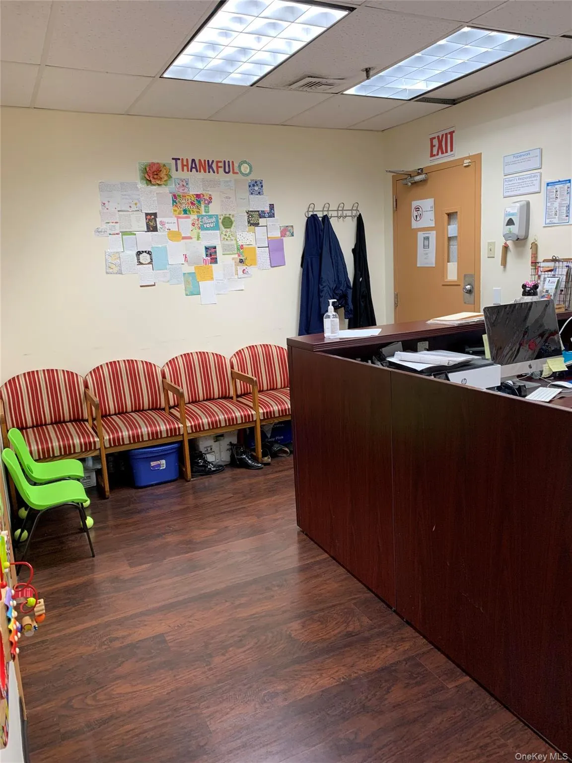 Reception area featuring a paneled ceiling Reception area featuring a paneled ceiling