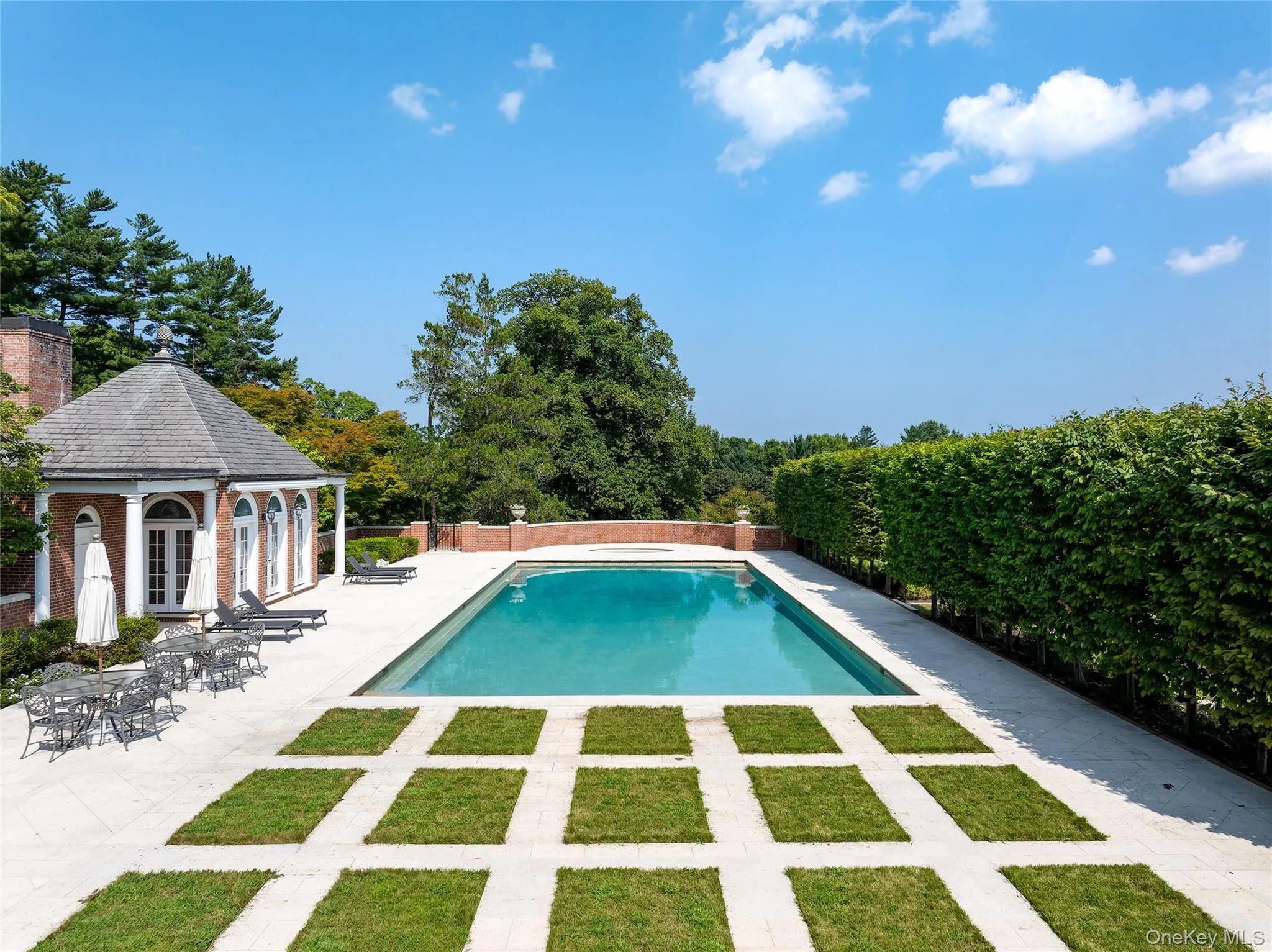 View of swimming pool with a gazebo, a patio, an outbuilding, a storage structure, and view of wooded area View of swimming pool with a gazebo, a patio, an outbuilding, a storage structure, and view of wooded area