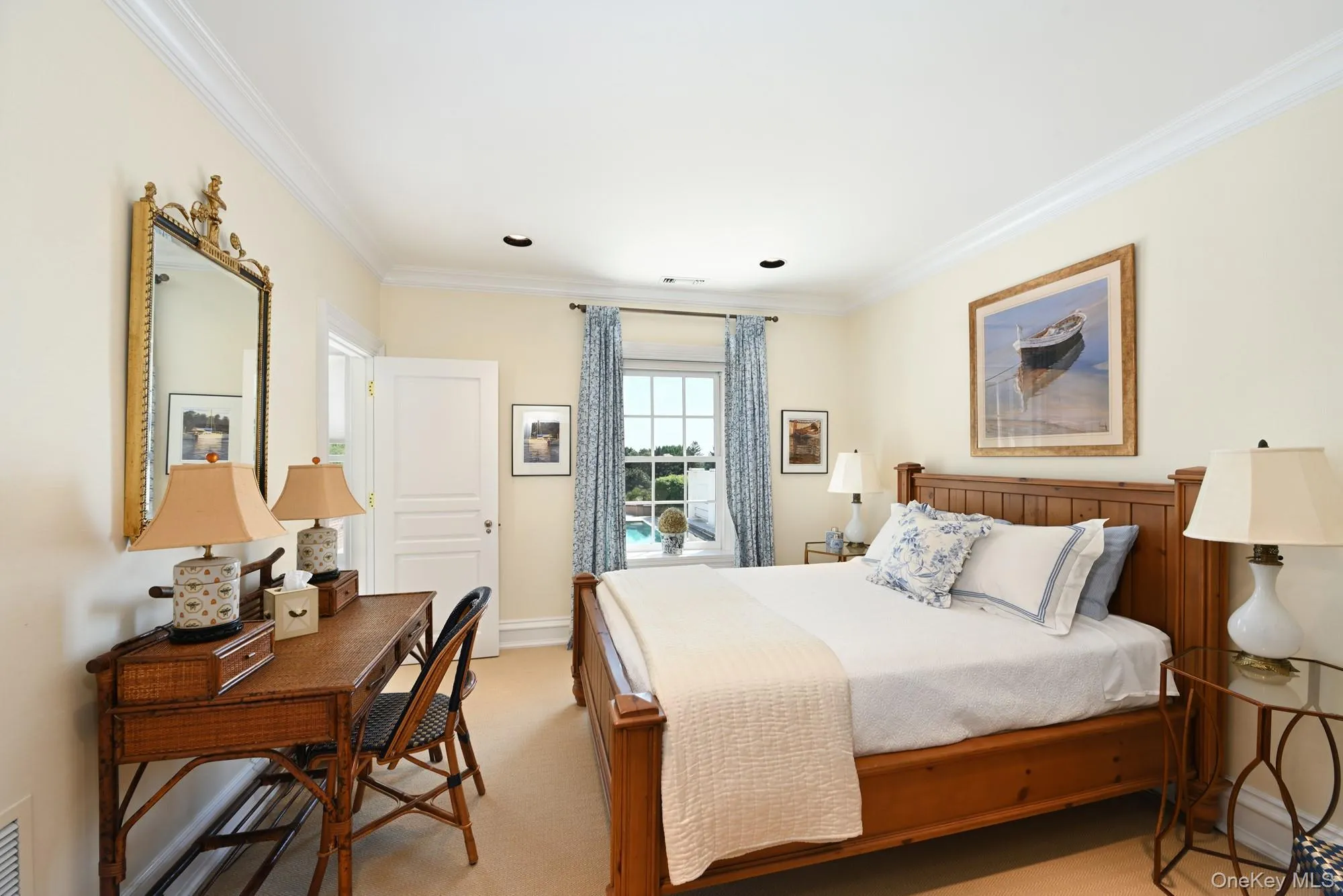 Bedroom with ornamental molding and light colored carpet Bedroom with ornamental molding and light colored carpet