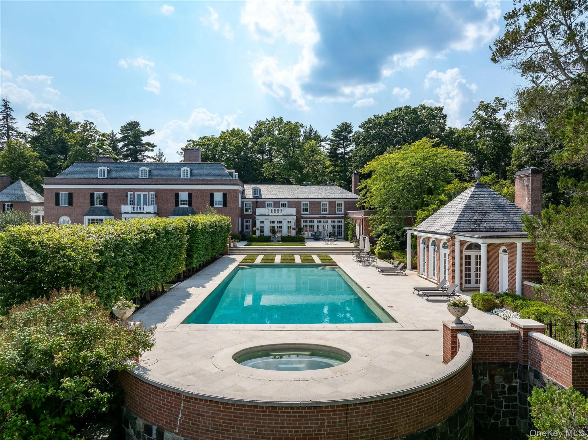 View of swimming pool with a patio area, a gazebo, an in-ground hot tub, a storage structure, and an outbuilding View of swimming pool with a patio area, a gazebo, an in-ground hot tub, a storage structure, and an outbuilding